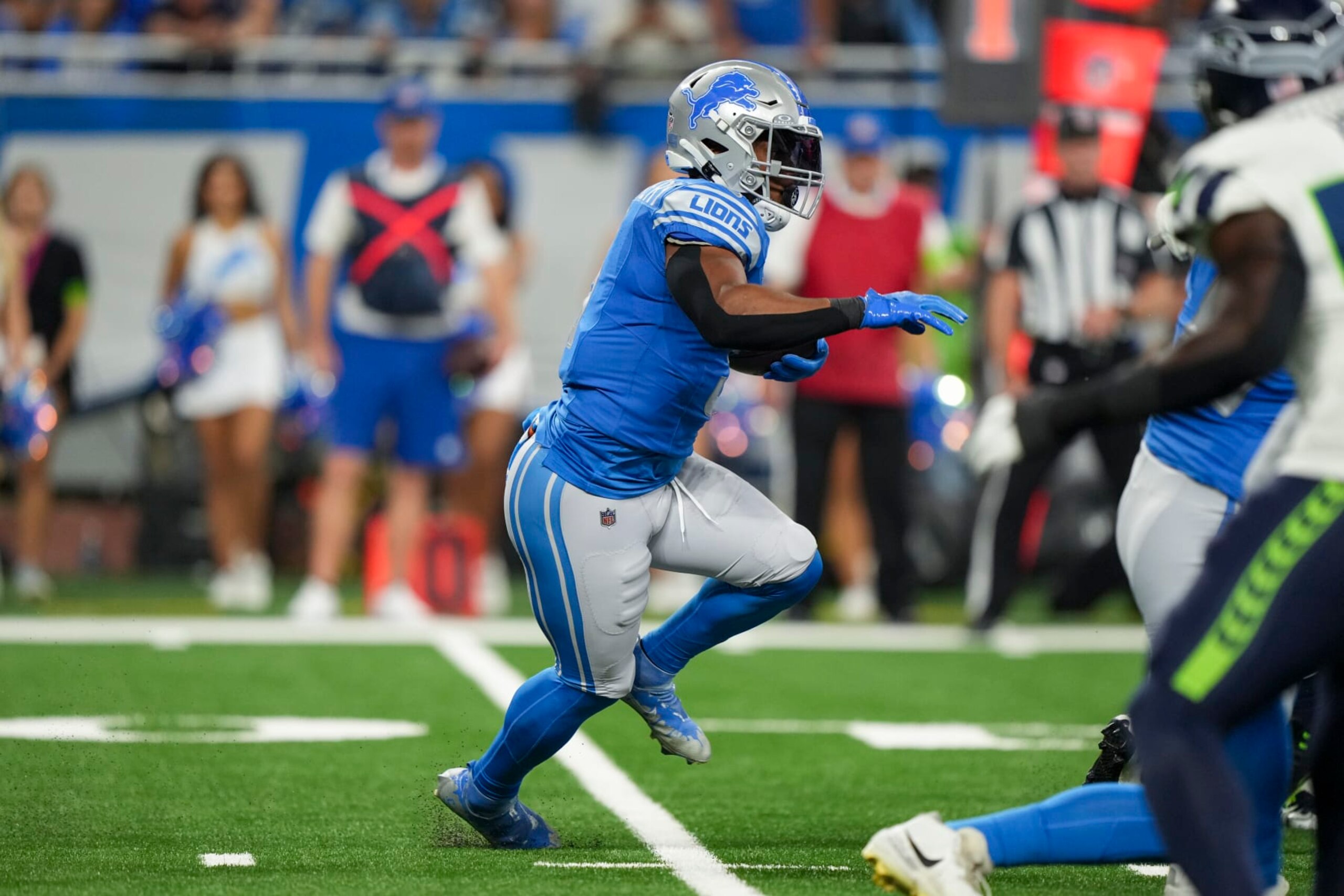 DETROIT, MI - SEPTEMBER 17: Running back David Montgomery #5 of the Detroit Lions runs the ball during the first half of an NFL football game against the Seattle Seahawks at Ford Field on September 17, 2023 in Detroit, Michigan. (Photo by Todd Rosenberg/Getty Images)