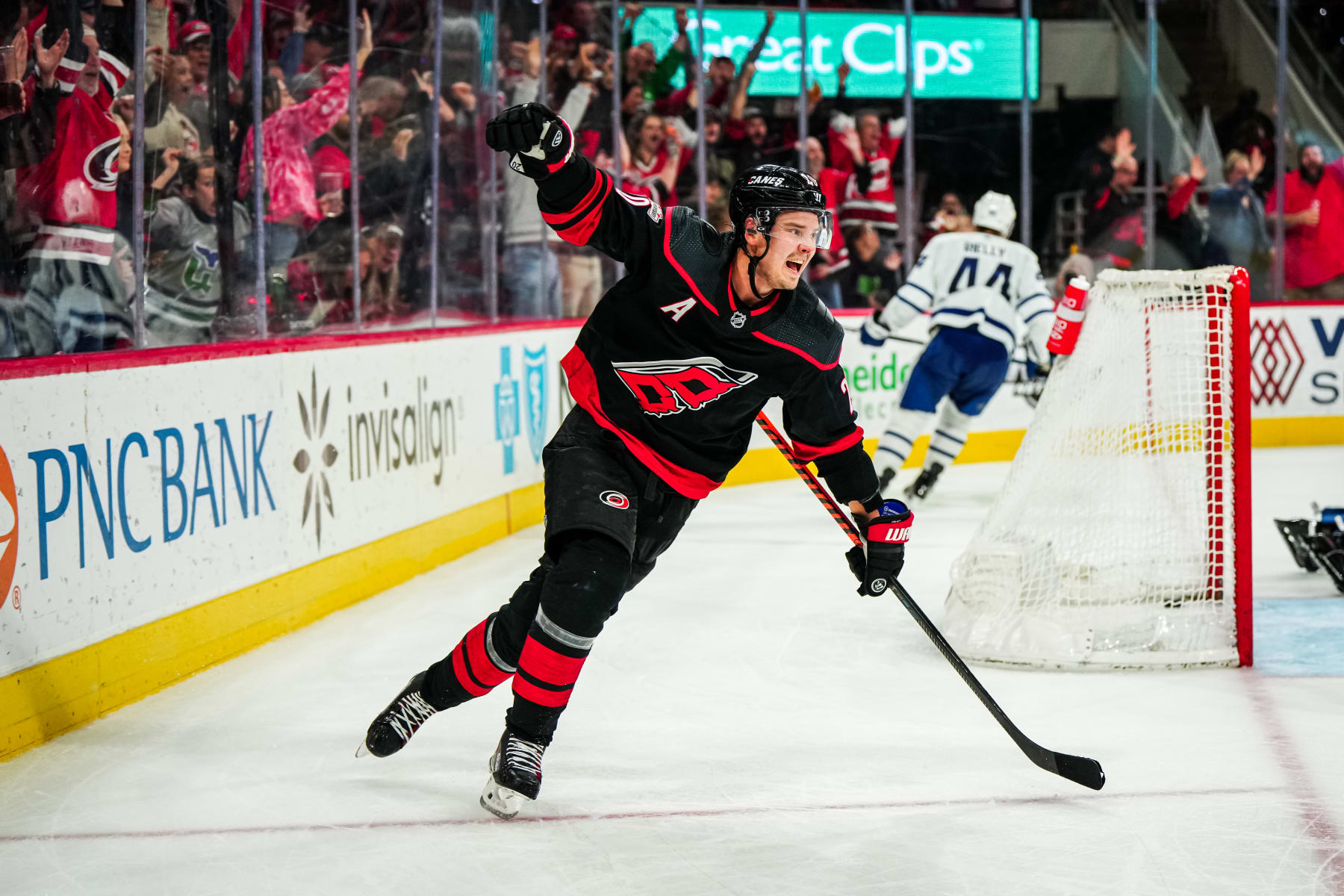 RALEIGH, NORTH CAROLINA - MARCH 25: Sebastian Aho #20 of the Carolina Hurricanes celebrates his game-winning goal in the third period against the Toronto Maple Leafs at PNC Arena on March 25, 2023 in Raleigh, North Carolina. (Photo by Josh Lavallee/NHLI via Getty Images)