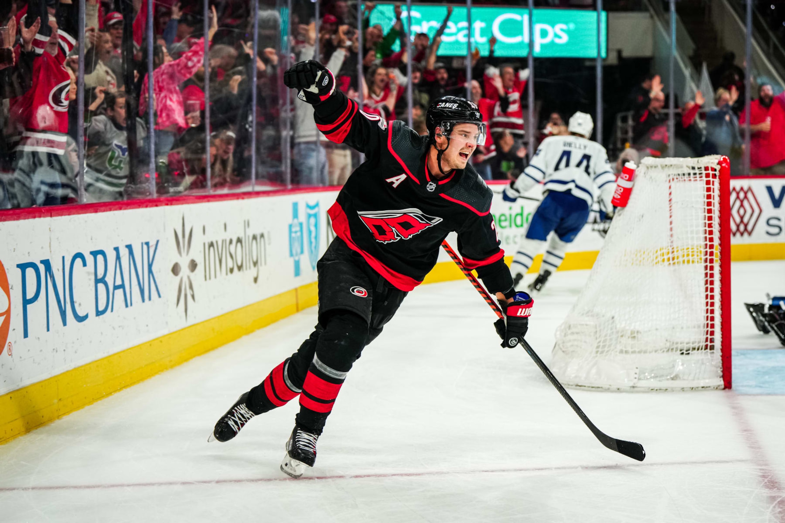 RALEIGH, NORTH CAROLINA - MARCH 25: Sebastian Aho #20 of the Carolina Hurricanes celebrates his game-winning goal in the third period against the Toronto Maple Leafs at PNC Arena on March 25, 2023 in Raleigh, North Carolina. (Photo by Josh Lavallee/NHLI via Getty Images)