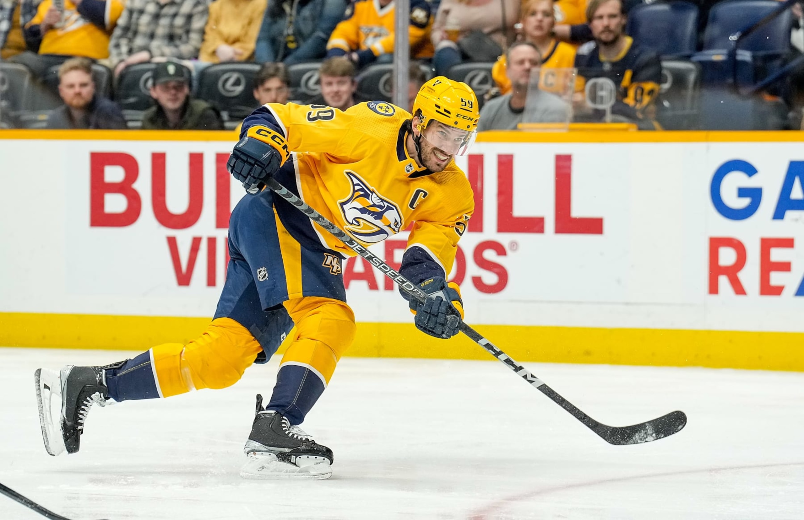 NASHVILLE, TENNESSEE - FEBRUARY 13: Roman Josi #59 of the Nashville Predators shoots the puck against the Arizona Coyotes during an NHL game at Bridgestone Arena on February 13, 2023 in Nashville, Tennessee. (Photo by John Russell/NHLI via Getty Images)