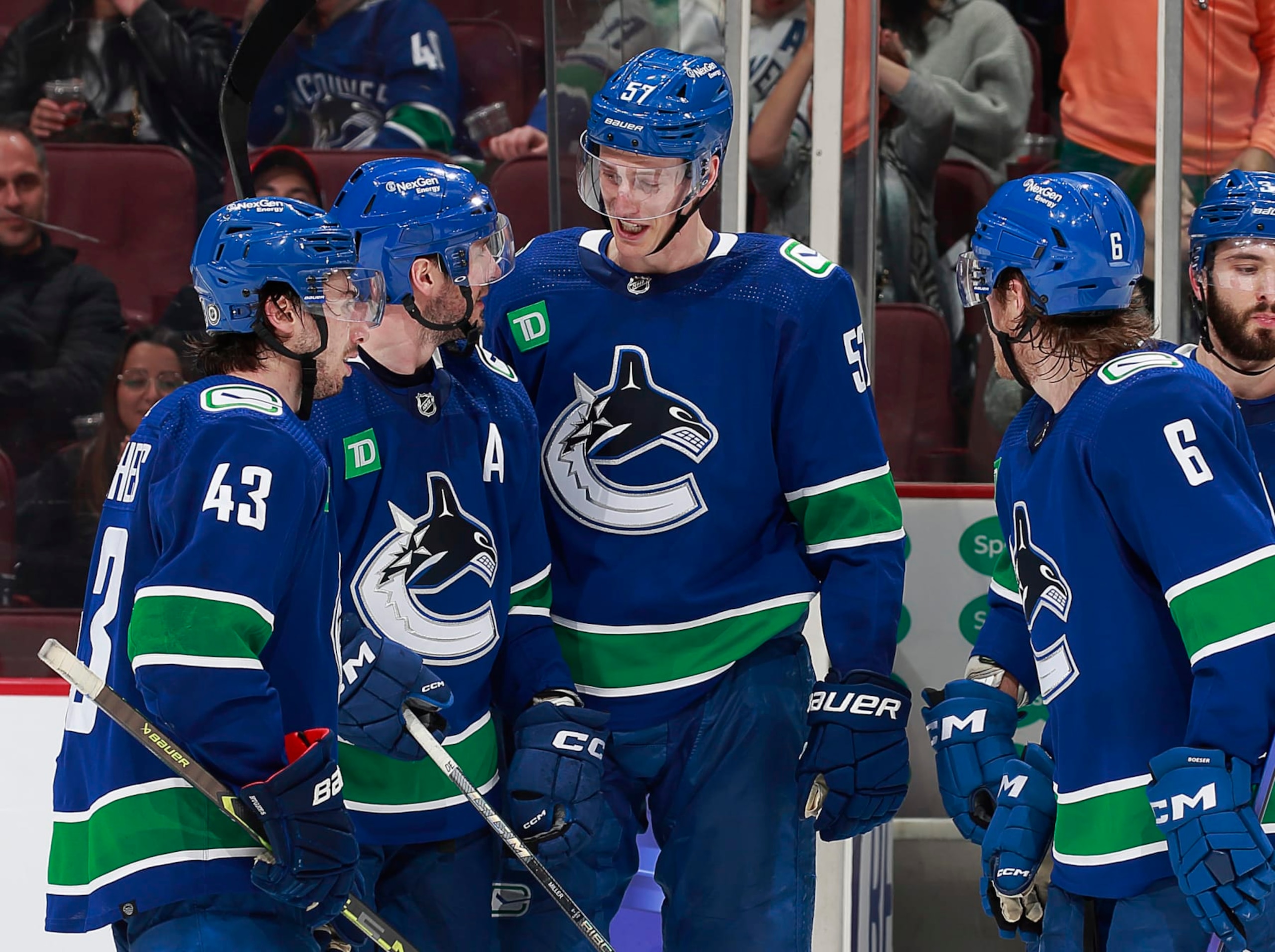 VANCOUVER, CANADA - APRIL 6: J.T. Miller #9 of the Vancouver Canucks celebrates his goal with teammates during the final minute of the third period of their NHL game against the Chicago Blackhawks at Rogers Arena April 6, 2023 in Vancouver, British Columbia, Canada.  (Photo by Jeff Vinnick/NHLI via Getty Images)