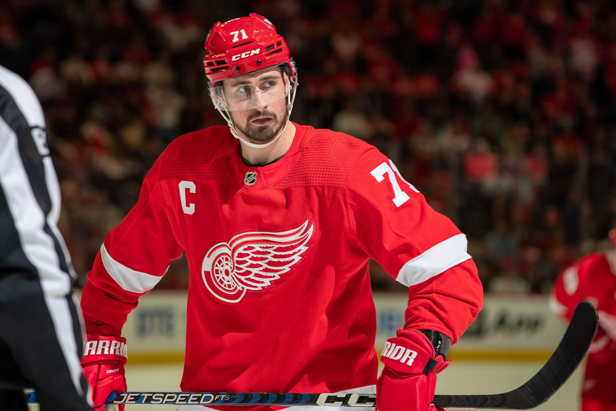DETROIT, MI - MARCH 30: Dylan Larkin #71 of the Detroit Red Wings gets set for the face-off against the Carolina Hurricanes during the third period of an NHL game at Little Caesars Arena on March 30, 2023 in Detroit, Michigan. Detroit defeated Carolina 3-2. (Photo by Dave Reginek/NHLI via Getty Images)
