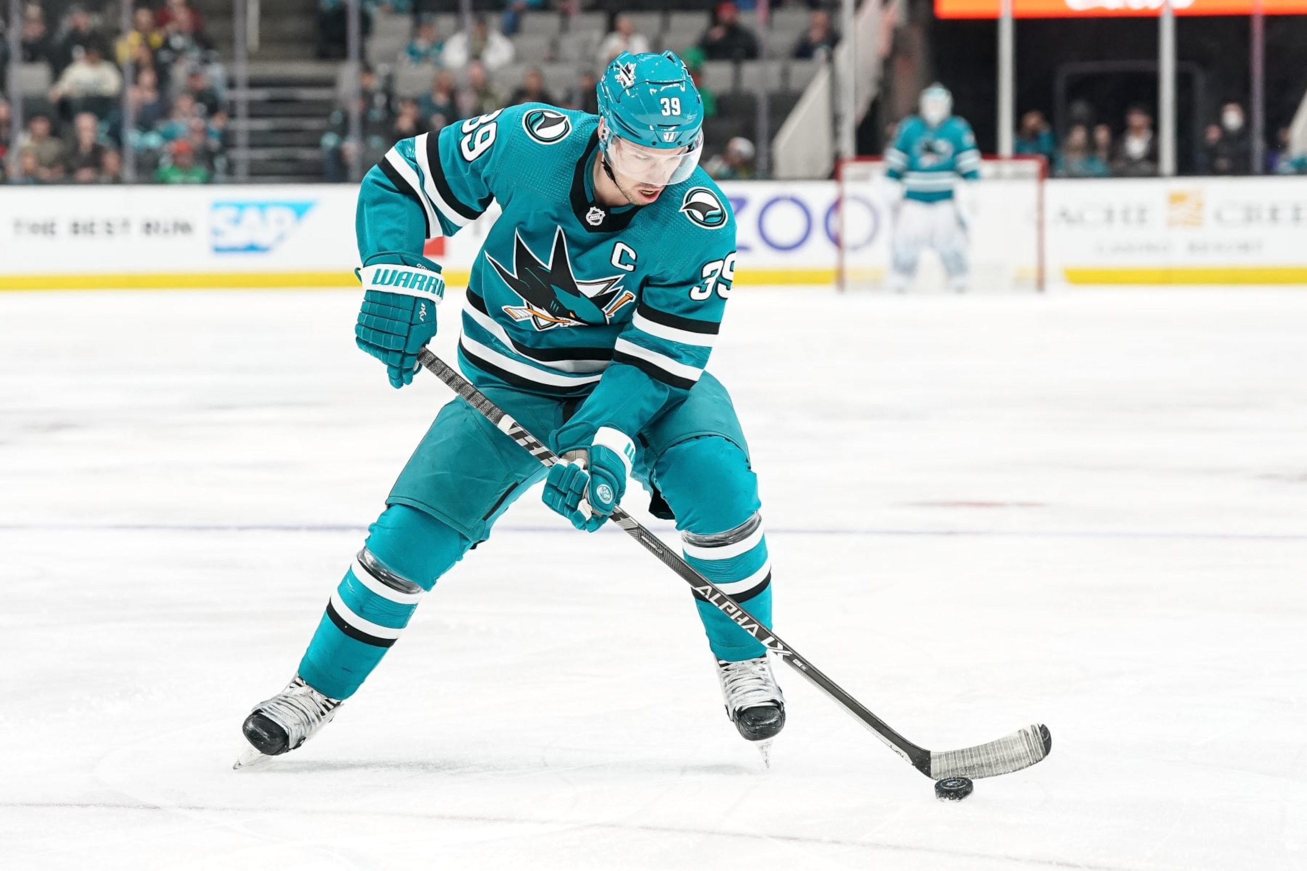 SAN JOSE, CA - MARCH 16: Logan Couture #39 of the San Jose Sharks skates with the puck against the Seattle Kraken in the first period at SAP Center on March 16, 2023 in San Jose, California. (Photo by Kavin Mistry/NHLI via Getty Images)