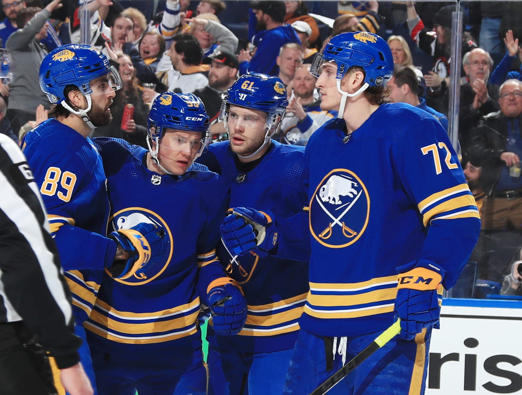 BUFFALO, NY - MARCH 24: Alex Tuch #89, Jeff Skinner #53, Riley Stillman #61 and Tage Thompson #72 of the Buffalo Sabres celebrate a goal during an NHL game against the Nashville Predators on March 24, 2023 at KeyBank Center in Buffalo, New York. (Photo by Bill Wippert/NHLI via Getty Images)