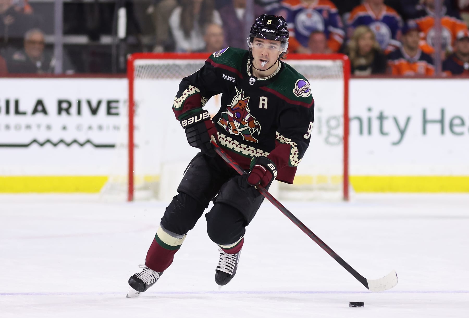 TEMPE, ARIZONA - MARCH 27: Clayton Keller #9 of the Arizona Coyotes skates with the puck during the NHL game at Mullett Arena on March 27, 2023 in Tempe, Arizona.  The Oilers defeated the Coyotes 5-4.  (Photo by Christian Petersen/Getty Images)