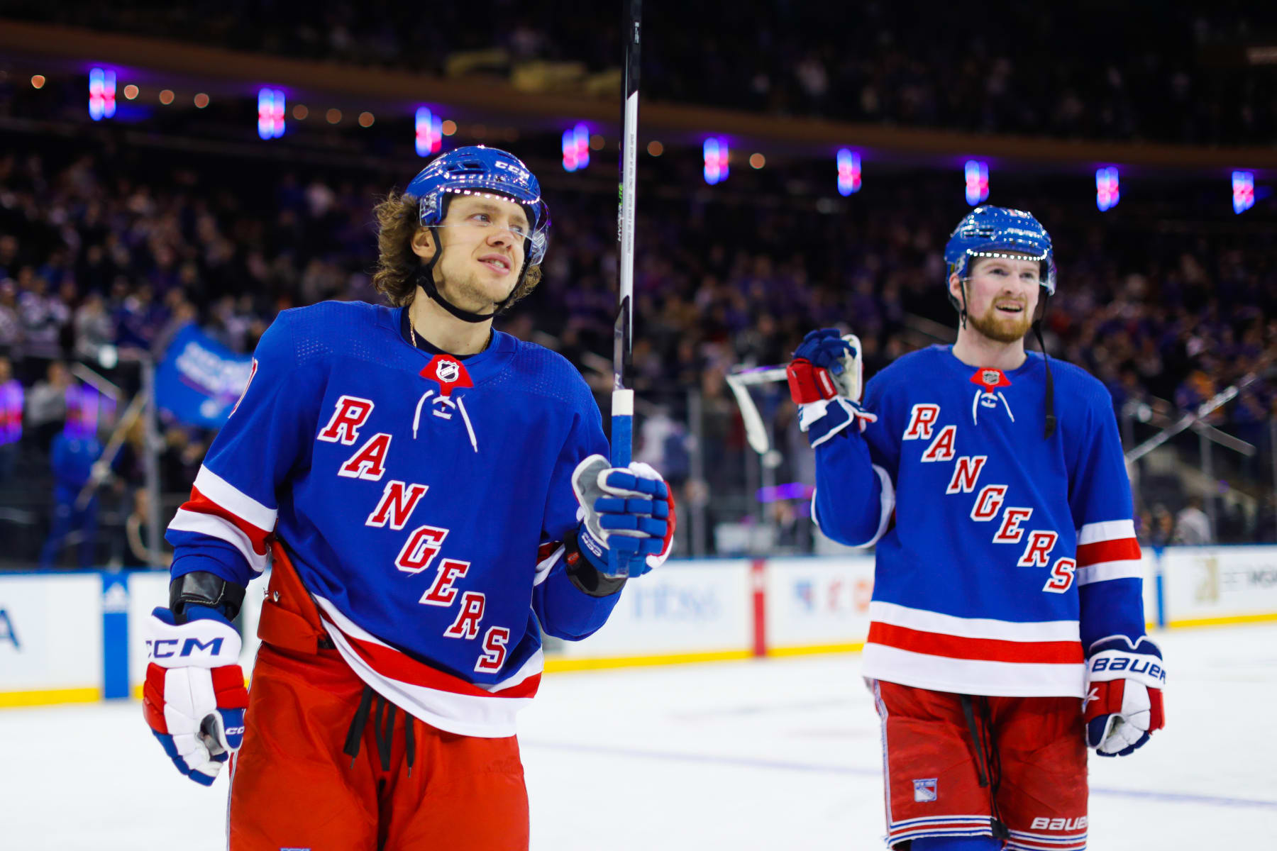 NEW YORK, NEW YORK - MARCH 19:  Artemi Panarin #10 and Alexis Lafreniere #13 of the New York Rangers celebrate after a 7-0 win against the Nashville Predators at Madison Square Garden on March 19, 2023 in New York City. (Photo by Jared Silber/NHLI via Getty Images)