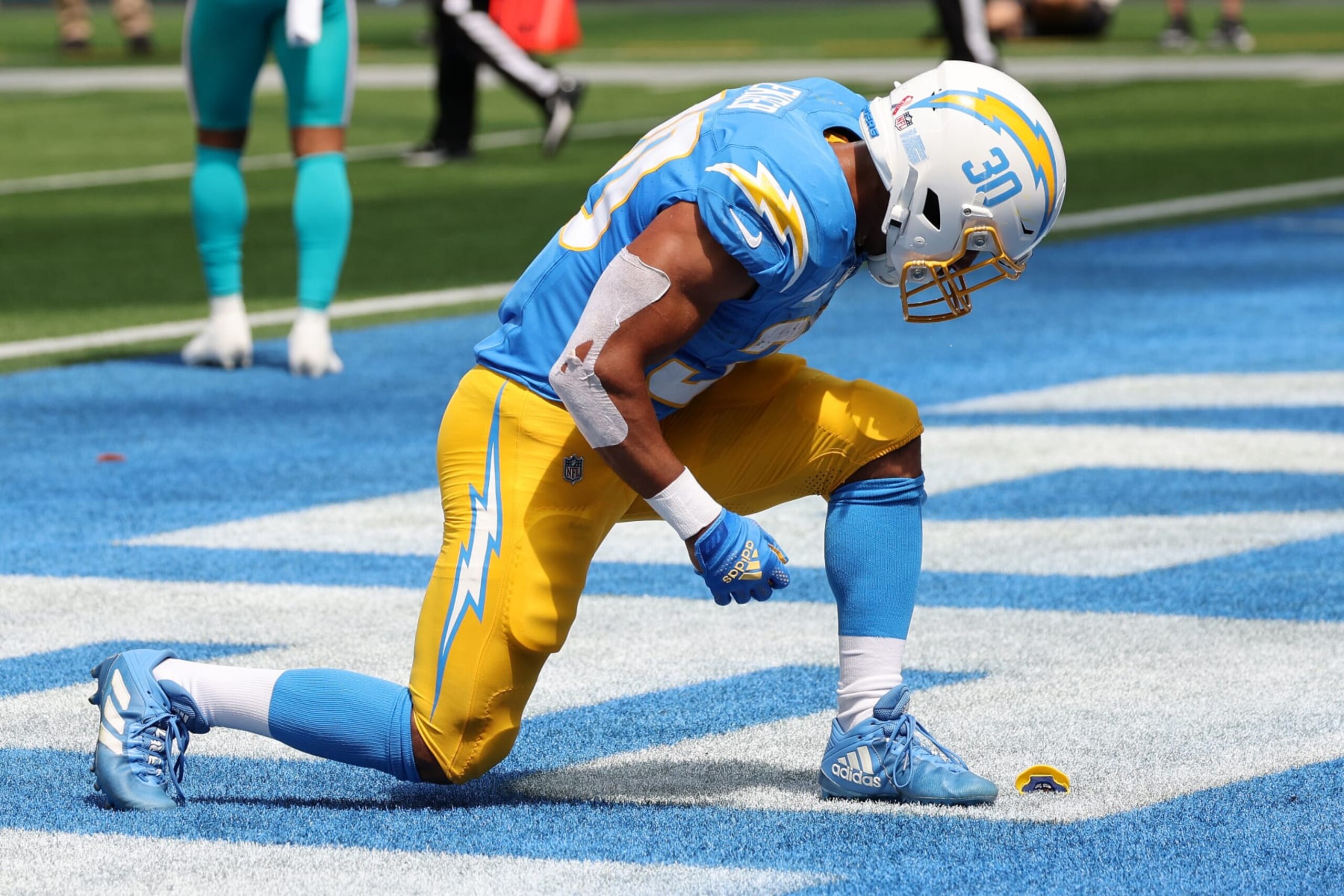 INGLEWOOD, CALIFORNIA - SEPTEMBER 10: Austin Ekeler #30 of the Los Angeles Chargers celebrates after a touchdown in the first quarter of a game against the Miami Dolphins at SoFi Stadium on September 10, 2023 in Inglewood, California. (Photo by Kevork Djansezian/Getty Images)