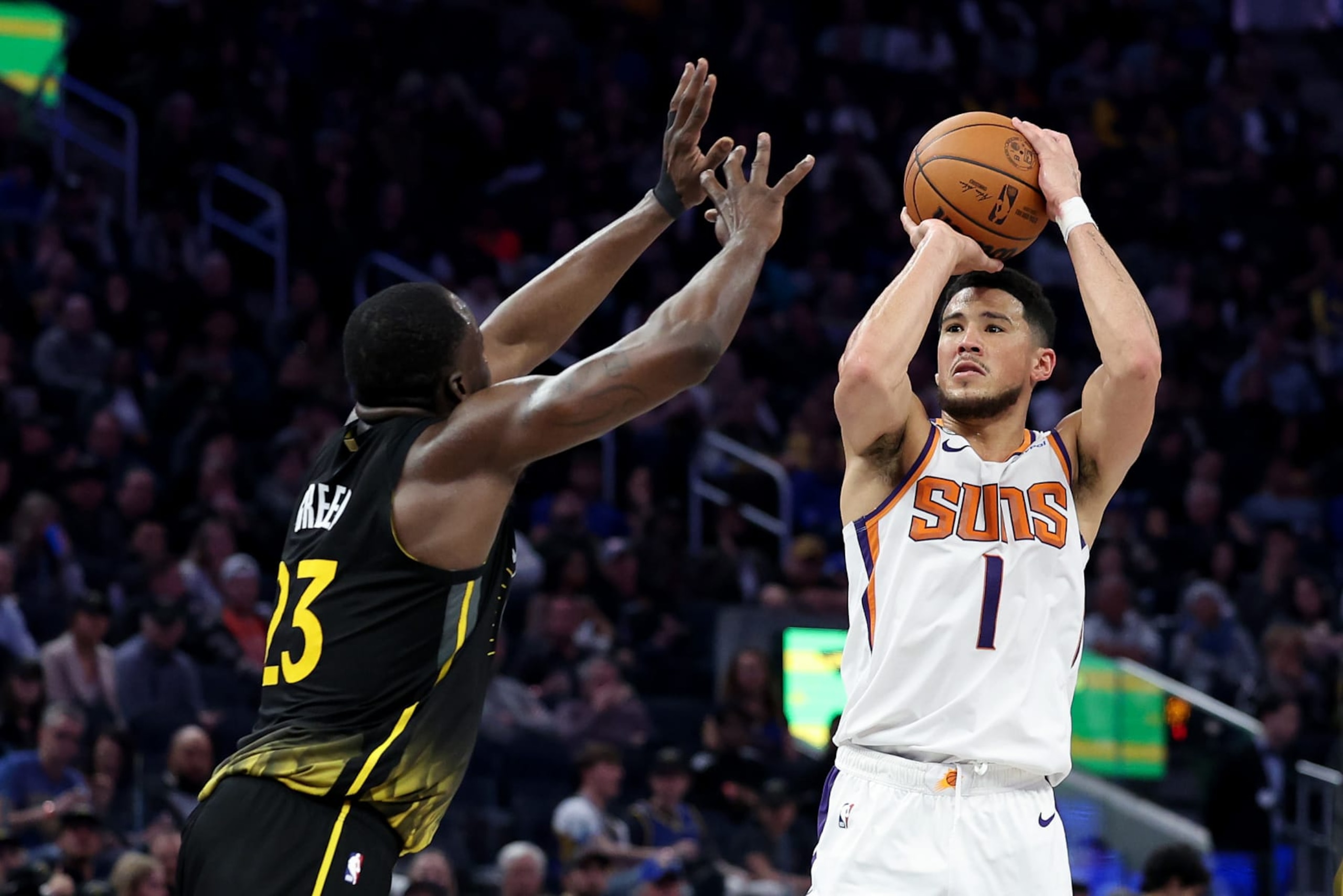 Draymond Green and Devin Booker Draymond Green and Devin Booker