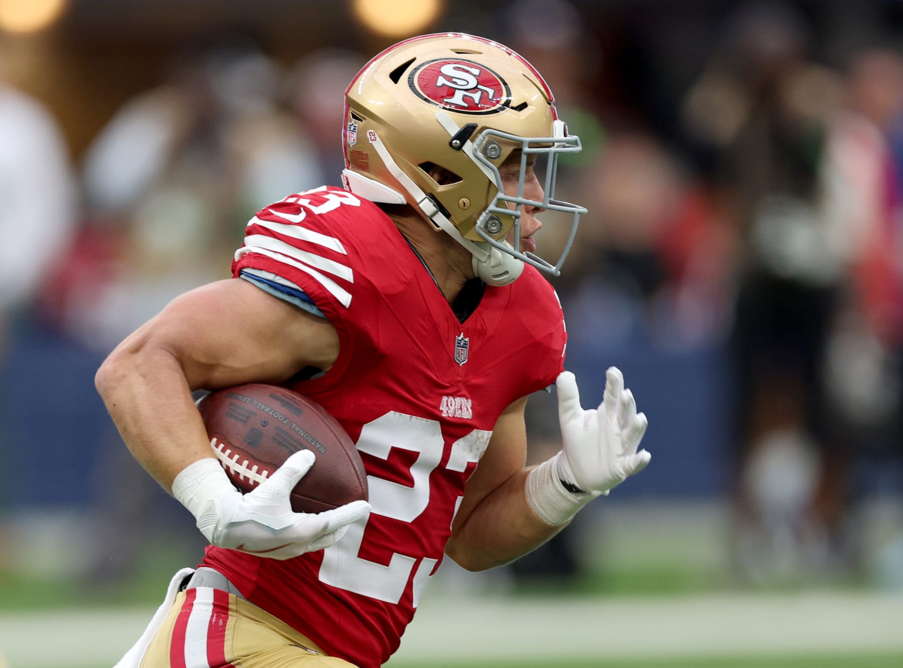 INGLEWOOD, CALIFORNIA - SEPTEMBER 17: Christian McCaffrey #23 of the San Francisco 49ers runs after a handoff during a 30-23 49ers win over the Los Angeles Rams at SoFi Stadium on September 17, 2023 in Inglewood, California. (Photo by Harry How/Getty Images)
