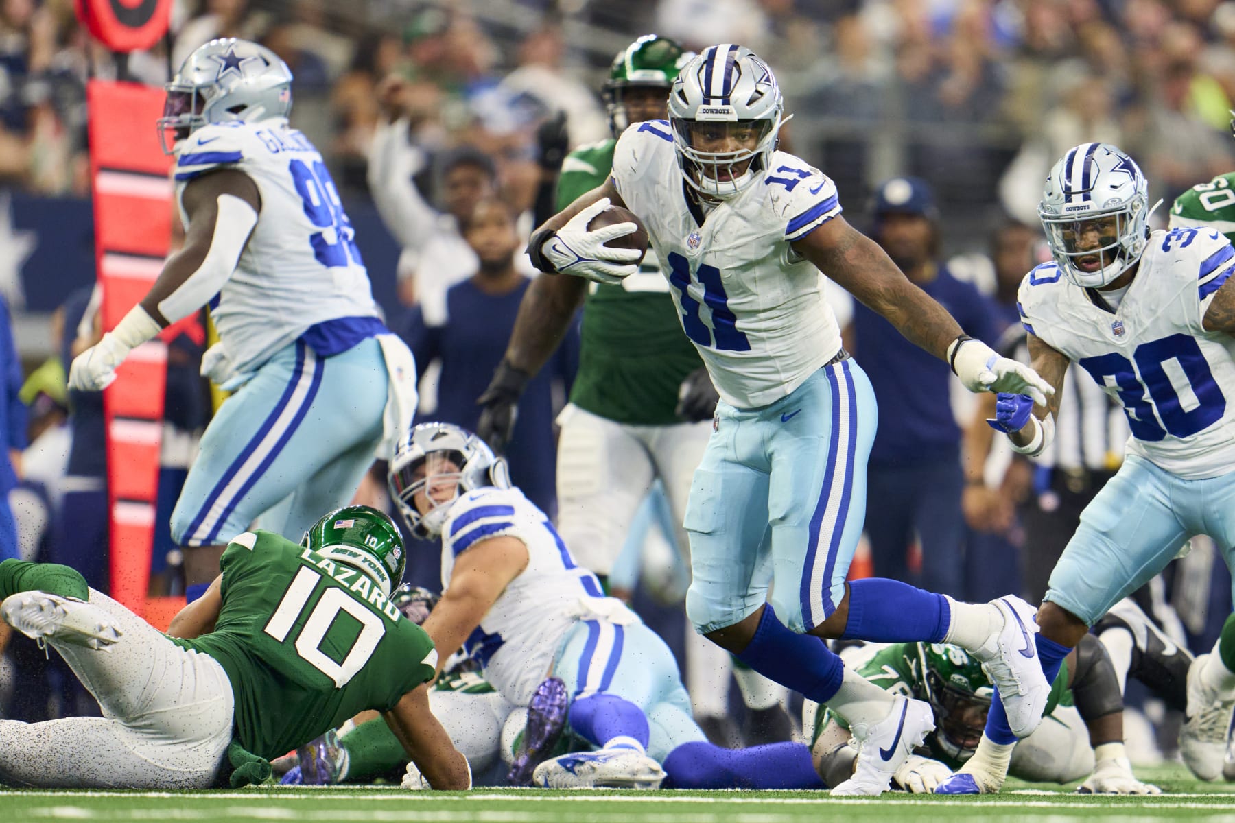 ARLINGTON, TX - SEPTEMBER 17: Micah Parsons #11 of the Dallas Cowboys recovers a fumble against the New York Jets during the second half at AT&T Stadium on September 17, 2023 in Arlington, Texas. (Photo by Cooper Neill/Getty Images)