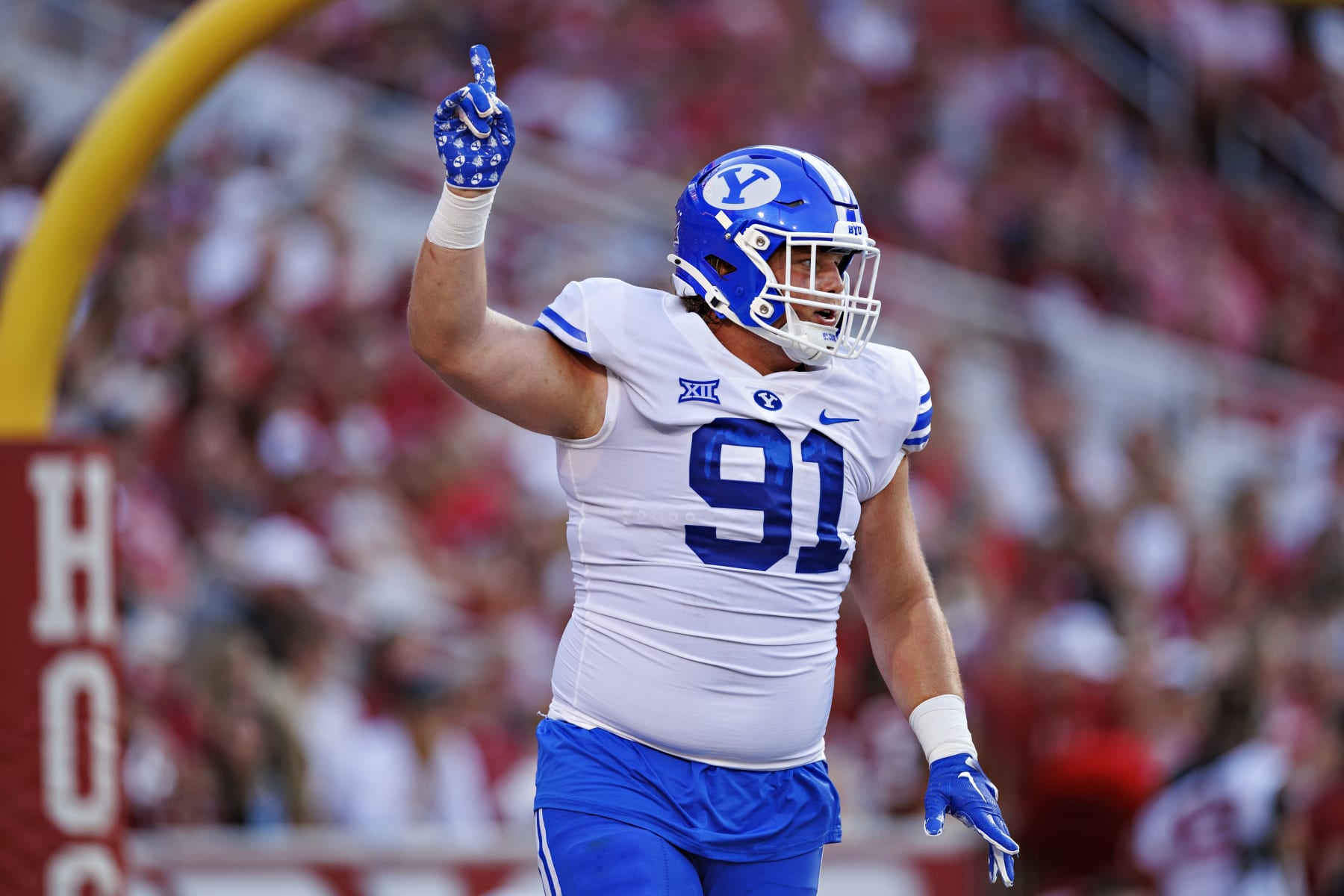 FAYETTEVILLE, ARKANSAS - SEPTEMBER 16: Jackson Cravens #91 of the BYU Cougars celebrates after his team scored a touchdown in the first half of the game against the Arkansas Razorbacks at Donald W. Reynolds Razorback Stadium on September 16, 2023 in Fayetteville, Arkansas. (Photo by Wesley Hitt/Getty Images)
