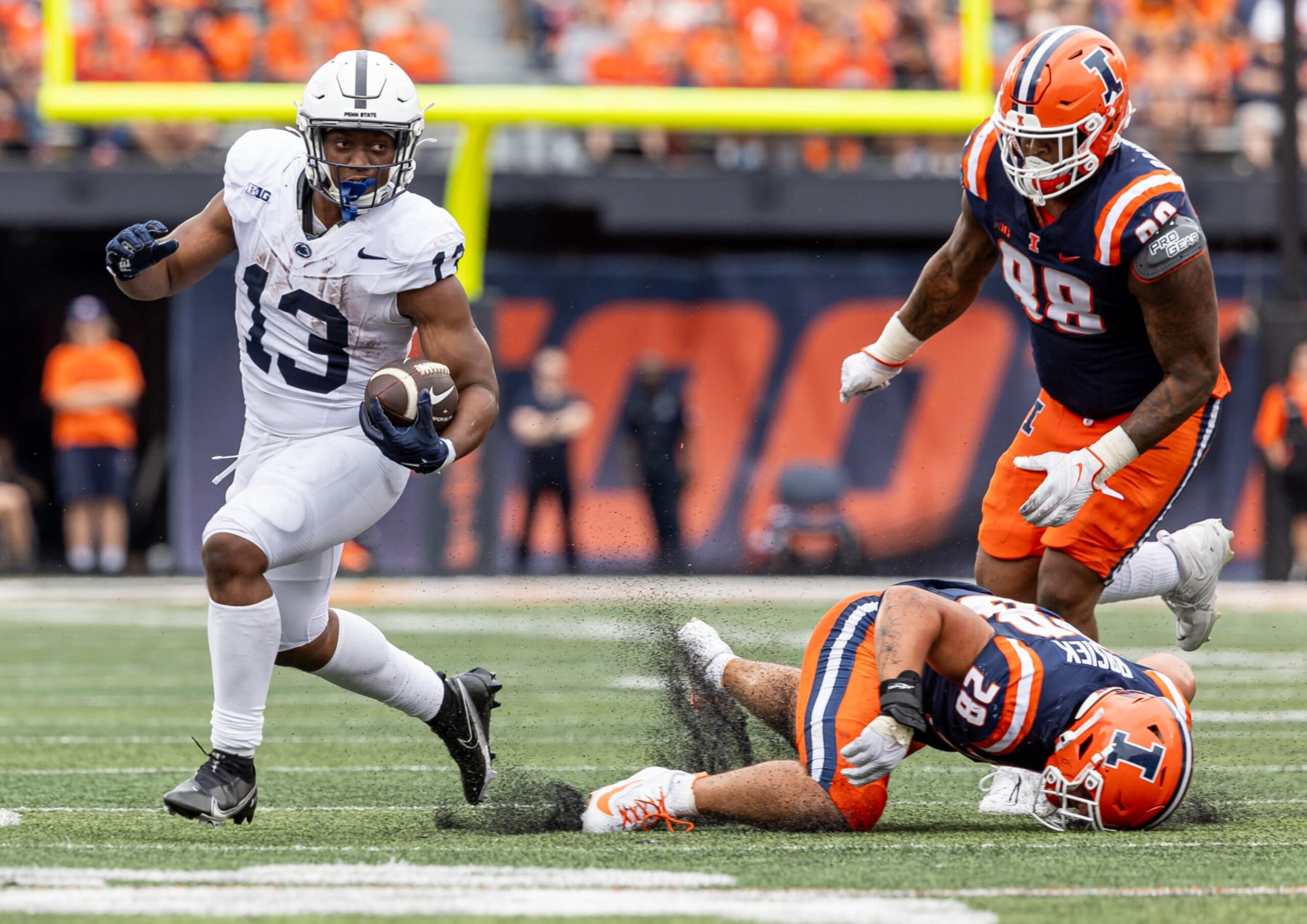 CHAMPAIGN, ILLINOIS - SEPTEMBER 16: Kaytron Allen #13 of the Penn State Nittany Lions runs the ball during the game against the Illinois Fighting Illini at Memorial Stadium on September 16, 2023 in Champaign, Illinois. (Photo by Michael Hickey/Getty Images)