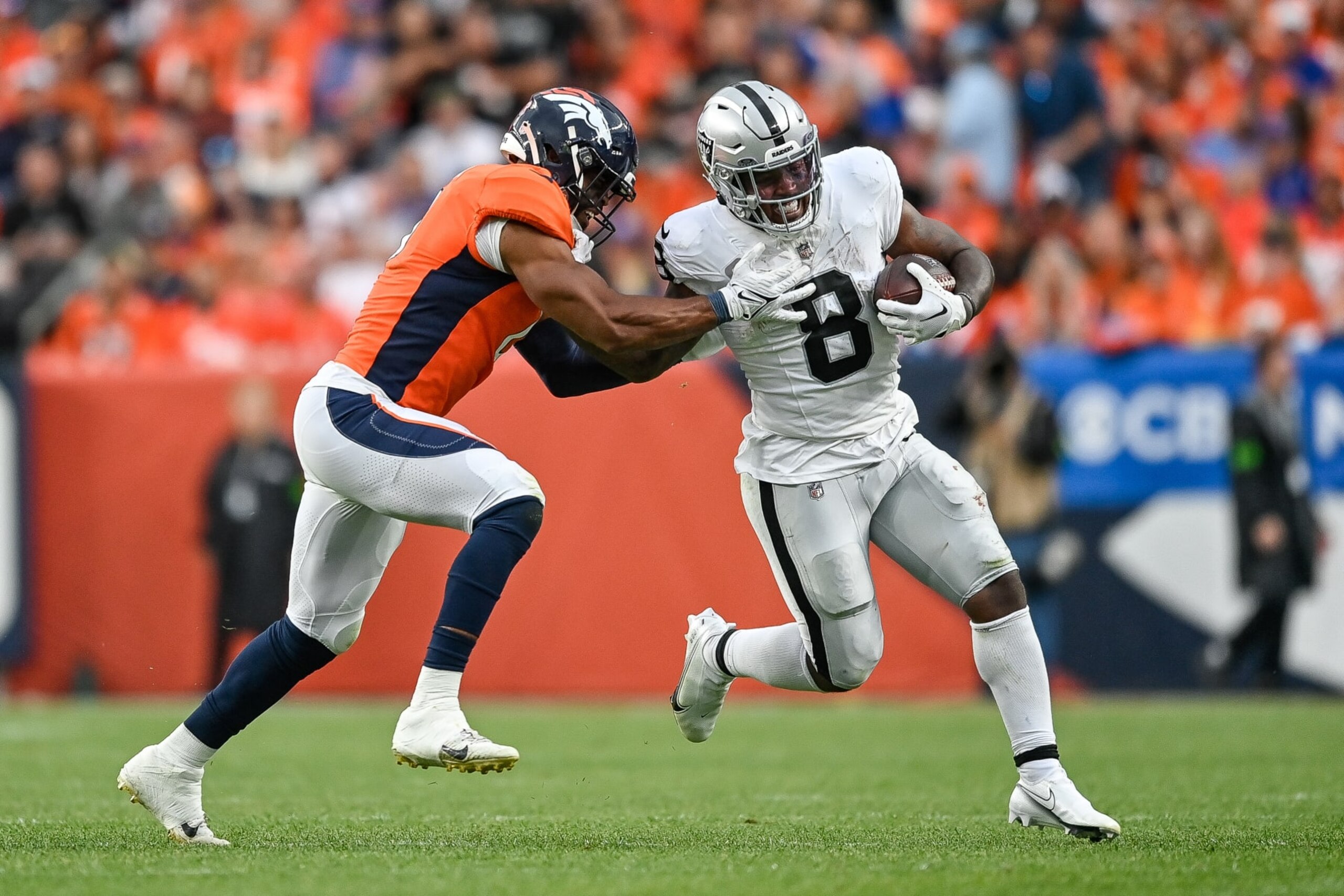 DENVER, COLORADO - SEPTEMBER 10:  Jonathon Cooper #0 of the Denver Broncos forces Josh Jacobs #8 of the Las Vegas Raiders out of bounds on a run in the third quarter at Empower Field at Mile High on September 10, 2023 in Denver, Colorado. (Photo by Dustin Bradford/Getty Images)