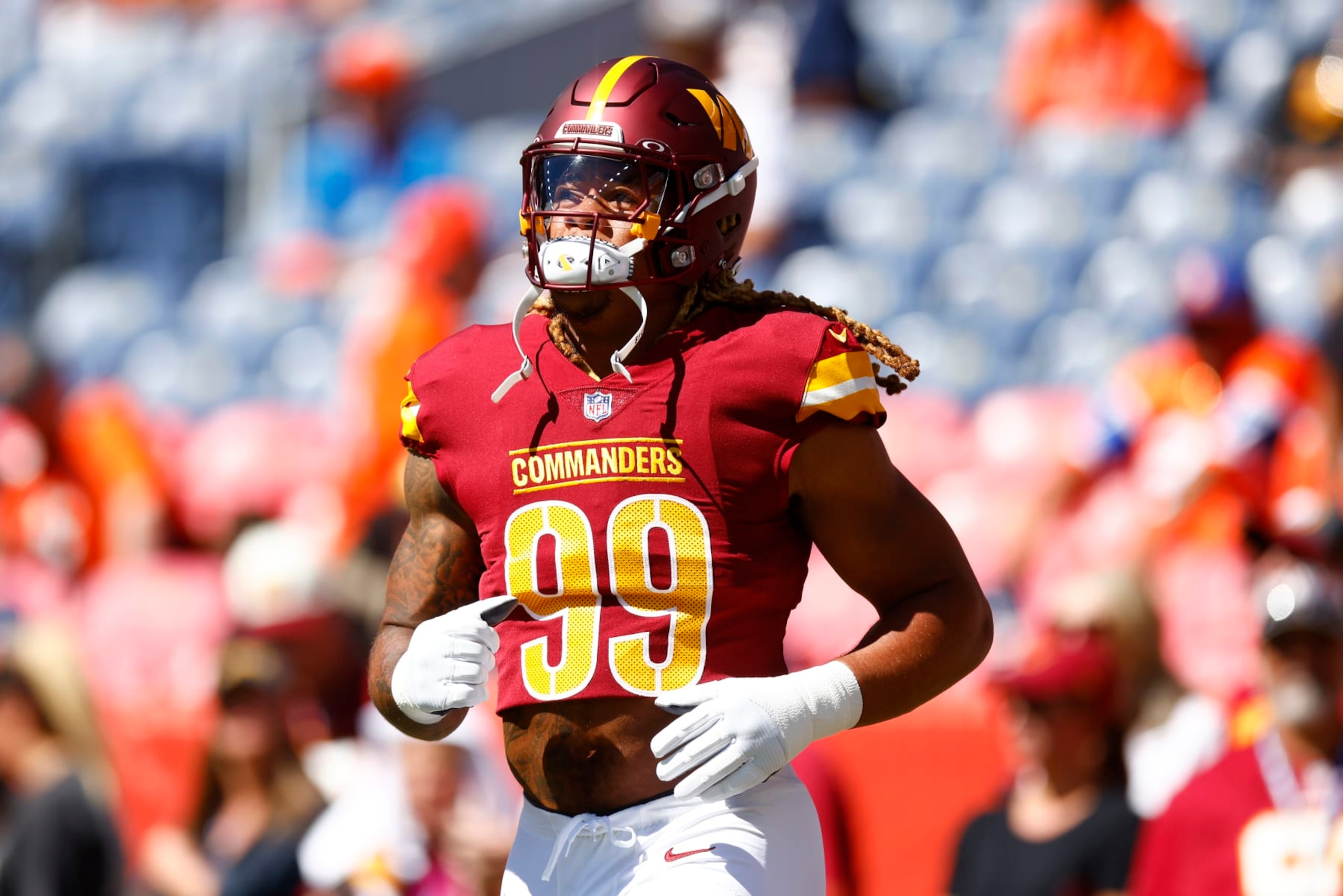 DENVER, COLORADO - SEPTEMBER 17: Chase Young #99 of the Washington Commanders looks on prior to a game against the Denver Broncos at Empower Field At Mile High on September 17, 2023 in Denver, Colorado. (Photo by Justin Edmonds/Getty Images) DENVER, COLORADO - SEPTEMBER 17: Chase Young #99 of the Washington Commanders looks on prior to a game against the Denver Broncos at Empower Field At Mile High on September 17, 2023 in Denver, Colorado. (Photo by Justin Edmonds/Getty Images)