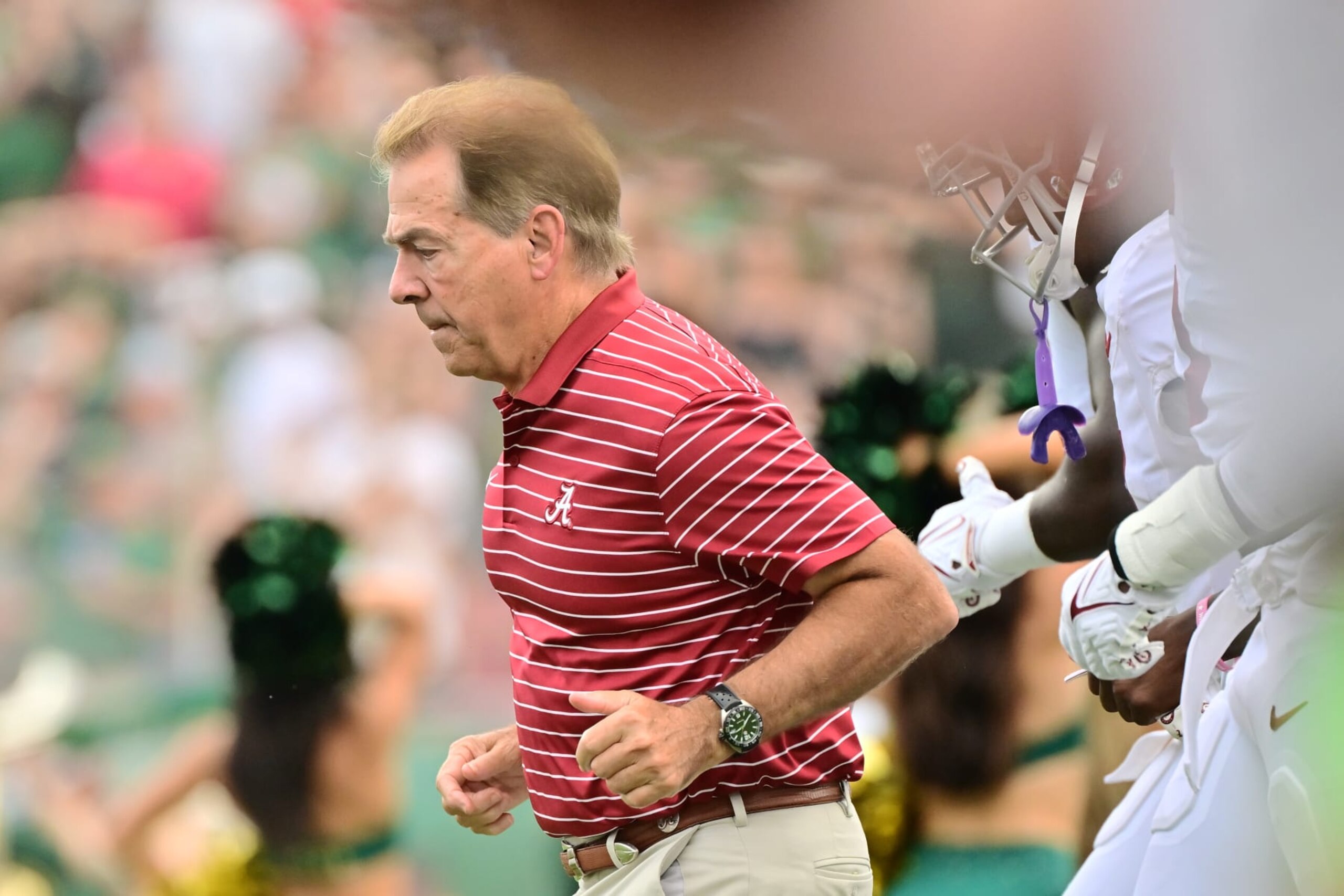 TAMPA, FLORIDA - SEPTEMBER 16: Head coach Nick Saban of the Alabama Crimson Tide leads the team to the field prior to a game against the South Florida Bulls at Raymond James Stadium on September 16, 2023 in Tampa, Florida. (Photo by Julio Aguilar/Getty Images)