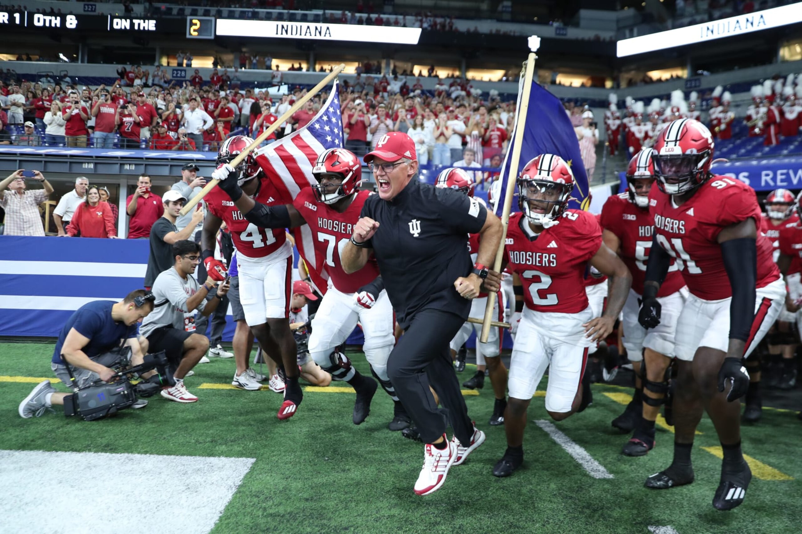 INDIANAPOLIS, IN - SEPTEMBER 16: Indiana Hoosiers coach Tom Allen leads his team onto the field before the game against the Louisville Cardinals at Lucas Oil Stadium in Indianapolis, Indiana. (Photo by Brian Spurlock/Icon Sportswire via Getty Images)