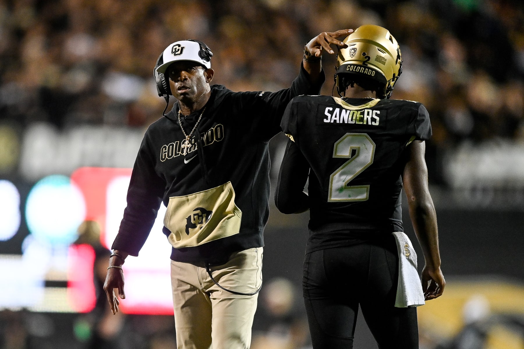 BOULDER, CO - SEPTEMBER 16:  Head coach Deion Sanders of the Colorado Buffaloes celebrates with quarterback Shedeur Sanders #2 after a fourth quarter touchdown against the Colorado State Rams at Folsom Field on September 16, 2023 in Boulder, Colorado. (Photo by Dustin Bradford/Getty Images)