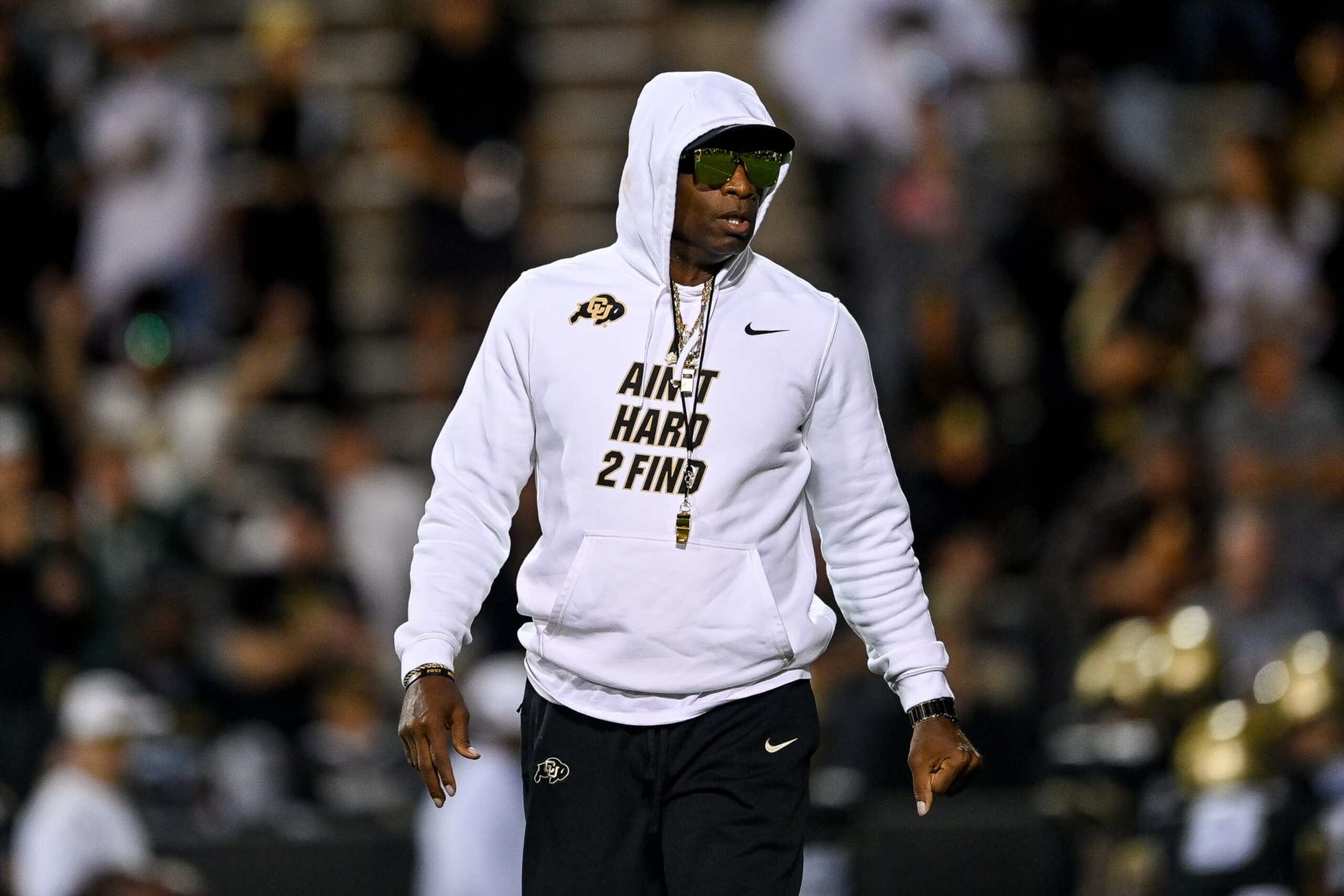 BOULDER, CO - SEPTEMBER 16:  Head coach Deion Sanders of the Colorado Buffaloes walks on the field as players warm up before a game against the Colorado State Rams at Folsom Field on September 16, 2023 in Boulder, Colorado. (Photo by Dustin Bradford/Getty Images)