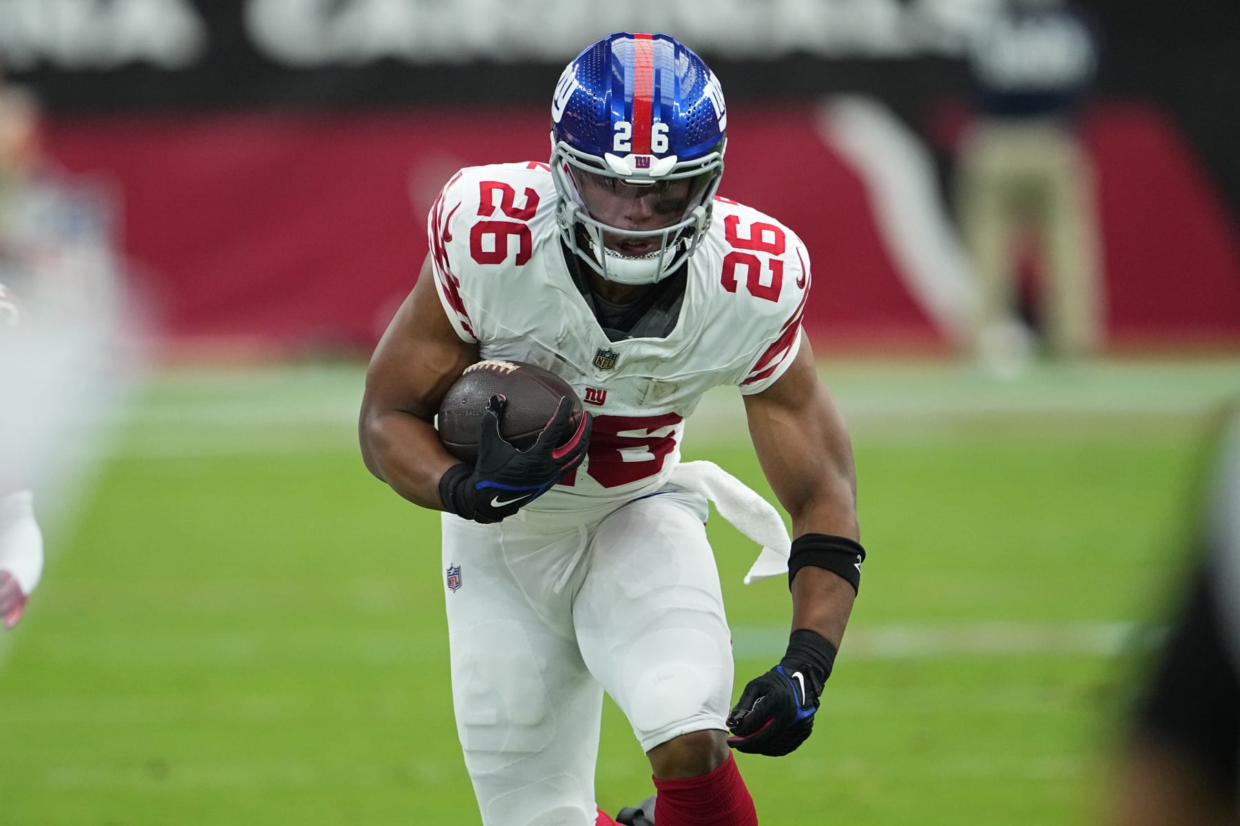 New York Giants running back Saquon Barkley (26) runs against the Arizona Cardinals during the first half of an NFL football game, Sunday, Sept. 17, 2023, in Glendale, Ariz. (AP Photo/Matt York)