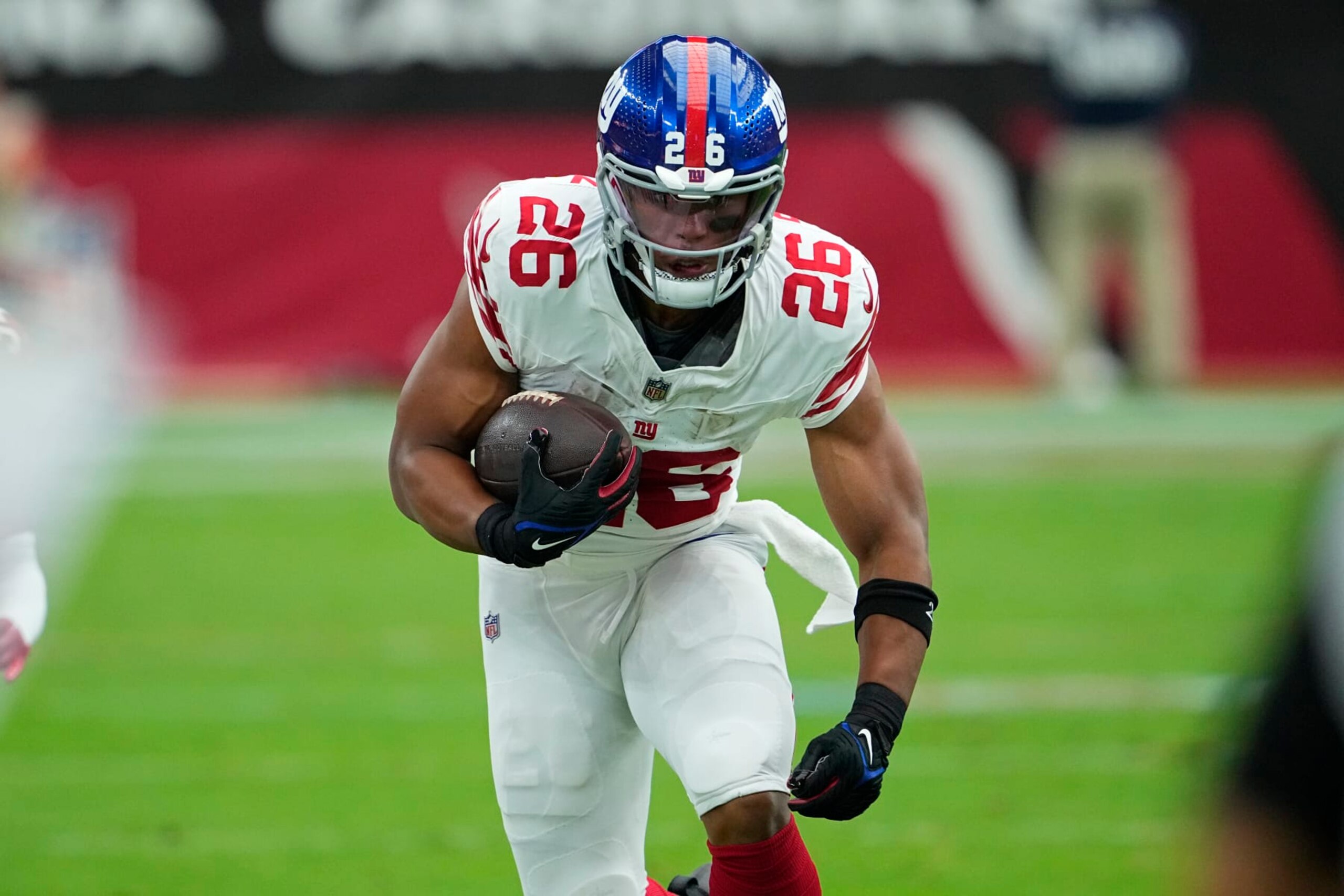 New York Giants running back Saquon Barkley (26) runs against the Arizona Cardinals during the first half of an NFL football game, Sunday, Sept. 17, 2023, in Glendale, Ariz. (AP Photo/Matt York)