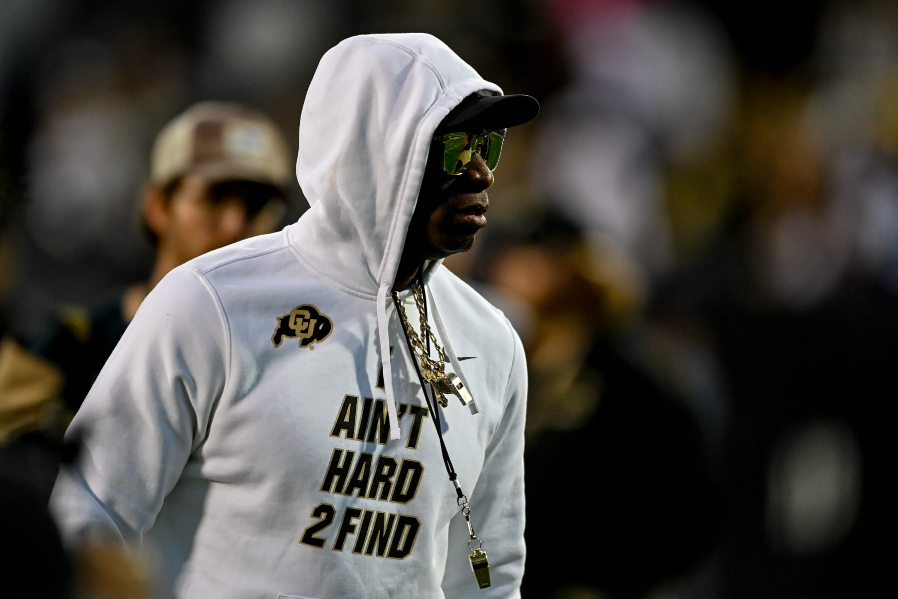 BOULDER, CO - SEPTEMBER 16:  Head coach Deion Sanders of the Colorado Buffaloes walks on the field as players warm up before a game against the Colorado State Rams at Folsom Field on September 16, 2023 in Boulder, Colorado. (Photo by Dustin Bradford/Getty Images)