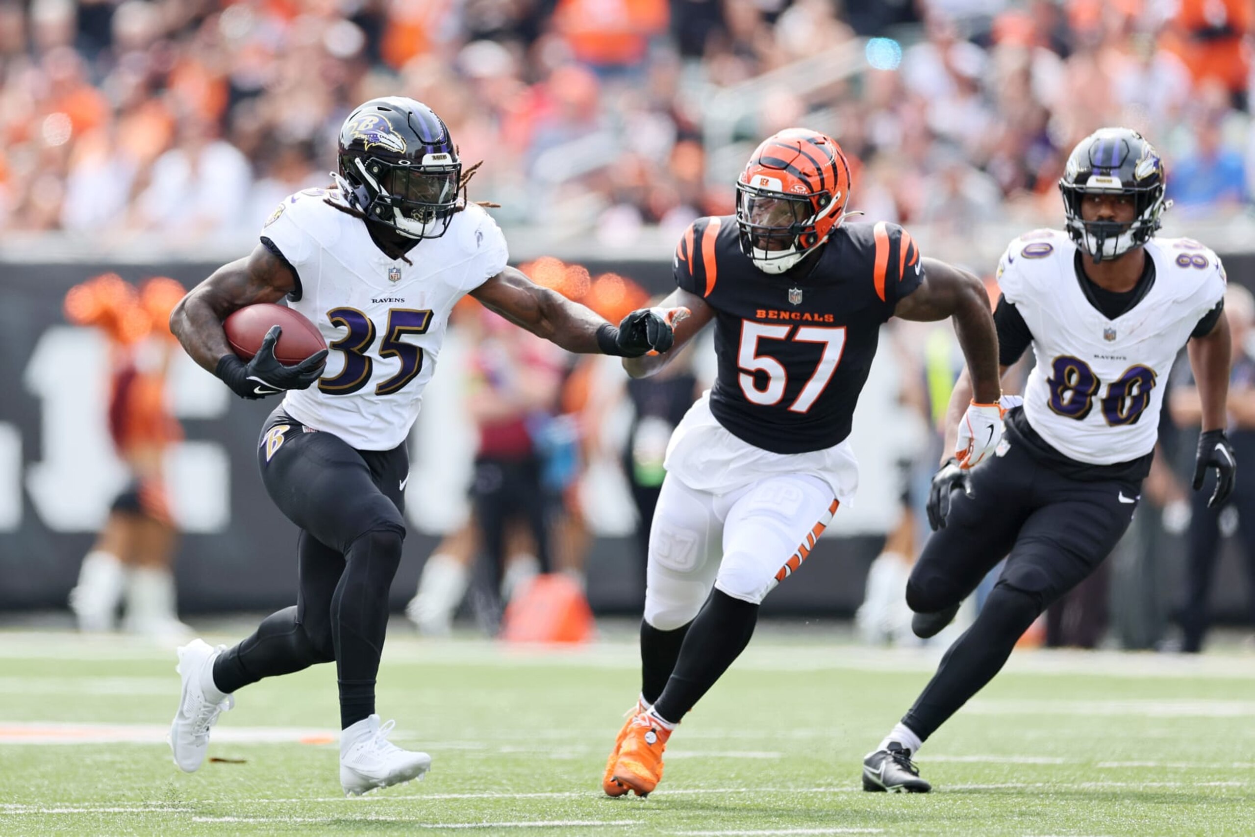 CINCINNATI, OHIO - SEPTEMBER 17: Gus Edwards #35 of the Baltimore Ravens runs the ball while defended by Germaine Pratt #57 of the Cincinnati Bengals during the first quarter at Paycor Stadium on September 17, 2023 in Cincinnati, Ohio. (Photo by Andy Lyons/Getty Images)