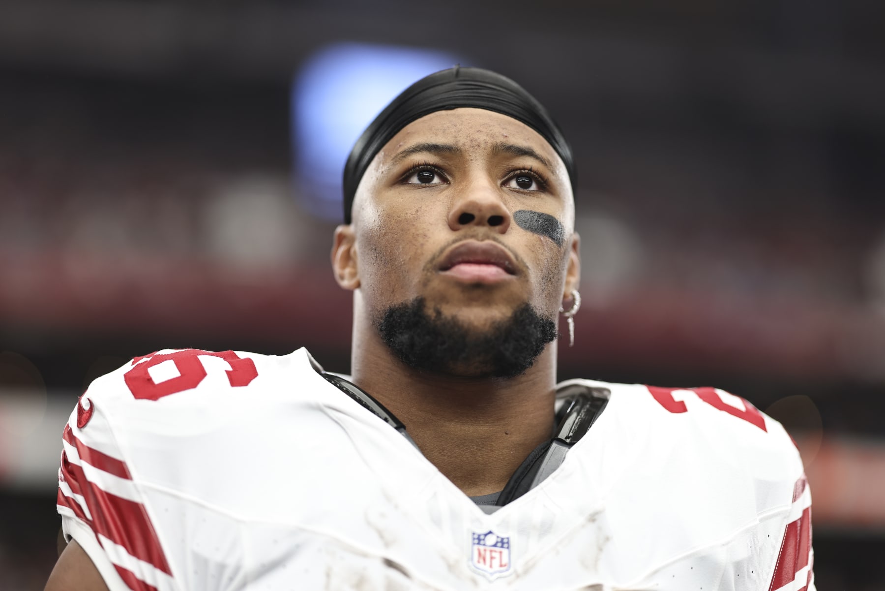 GLENDALE, ARIZONA - SEPTEMBER 17: Saquon Barkley #26 of the New York Giants looks on during the national anthem prior to an NFL football game between the Arizona Cardinals and the New York Giants at State Farm Stadium on September 17, 2023 in Glendale, Arizona. (Photo by Michael Owens/Getty Images)