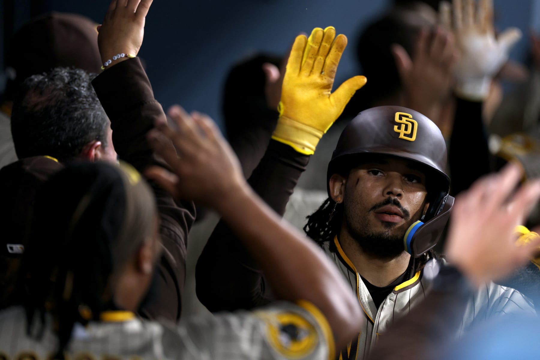 LOS ANGELES, CALIFORNIA - SEPTEMBER 13: Luis Campusano #12 of the San Diego Padres celebrates his three run home run in the dugout, to take a 4-0 lead over the Los Angeles Dodgers, during the fourth inning at Dodger Stadium on September 13, 2023 in Los Angeles, California. (Photo by Harry How/Getty Images)