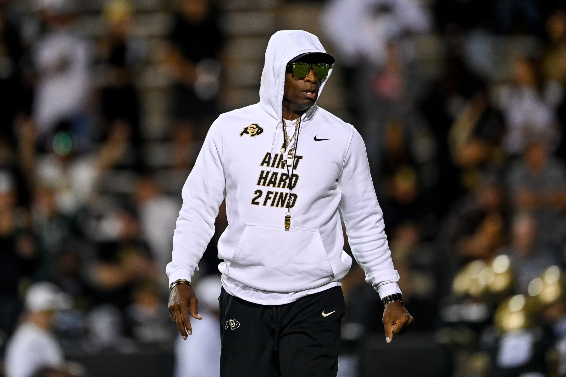 BOULDER, CO - SEPTEMBER 16:  Head coach Deion Sanders of the Colorado Buffaloes walks on the field as players warm up before a game against the Colorado State Rams at Folsom Field on September 16, 2023 in Boulder, Colorado. (Photo by Dustin Bradford/Getty Images)