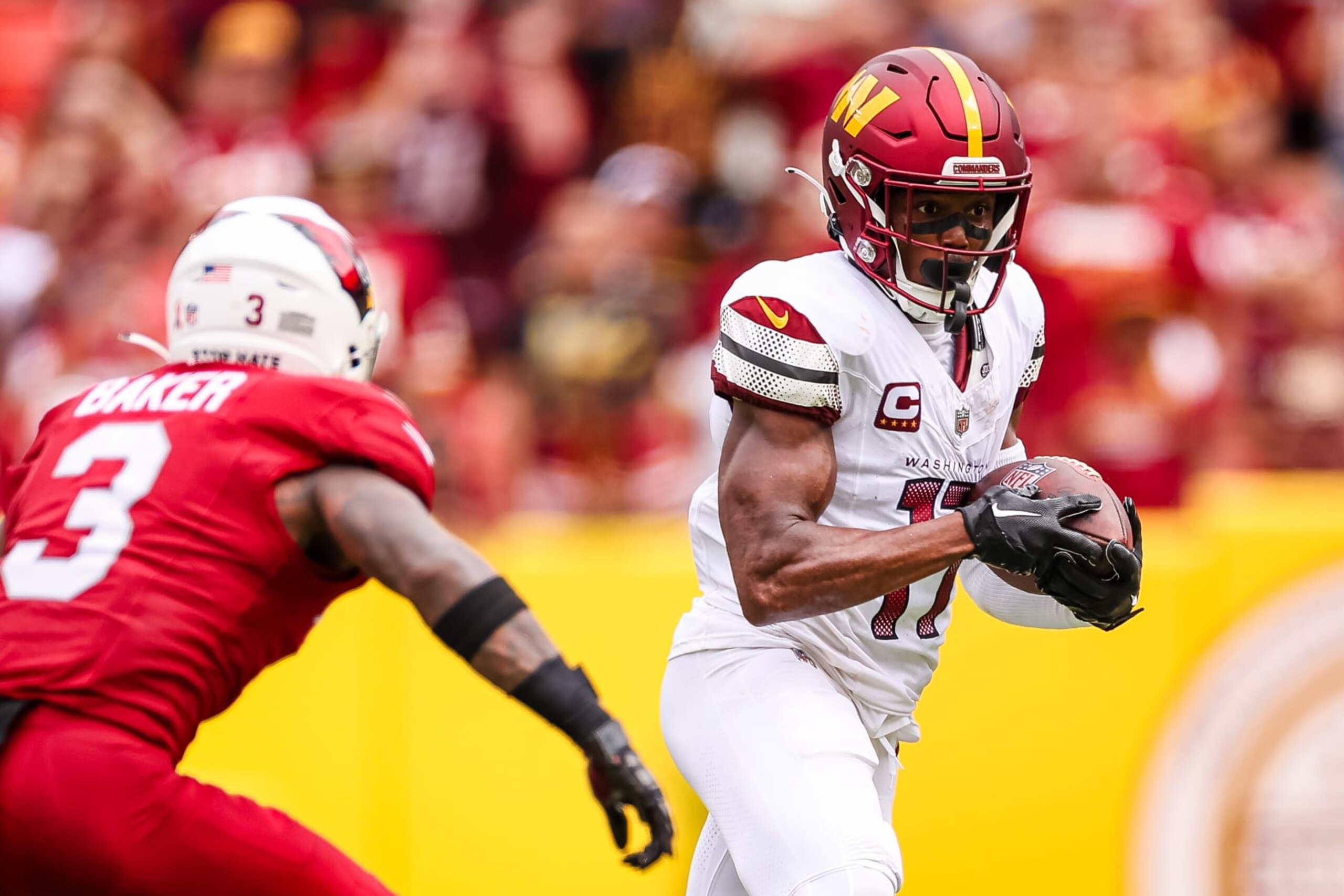 LANDOVER, MD - SEPTEMBER 10: Terry McLaurin #17 of the Washington Commanders catches a pass in front of Budda Baker #3 of the Arizona Cardinals during the first half of the game at FedExField on September 10, 2023 in Landover, Maryland. (Photo by Scott Taetsch/Getty Images)