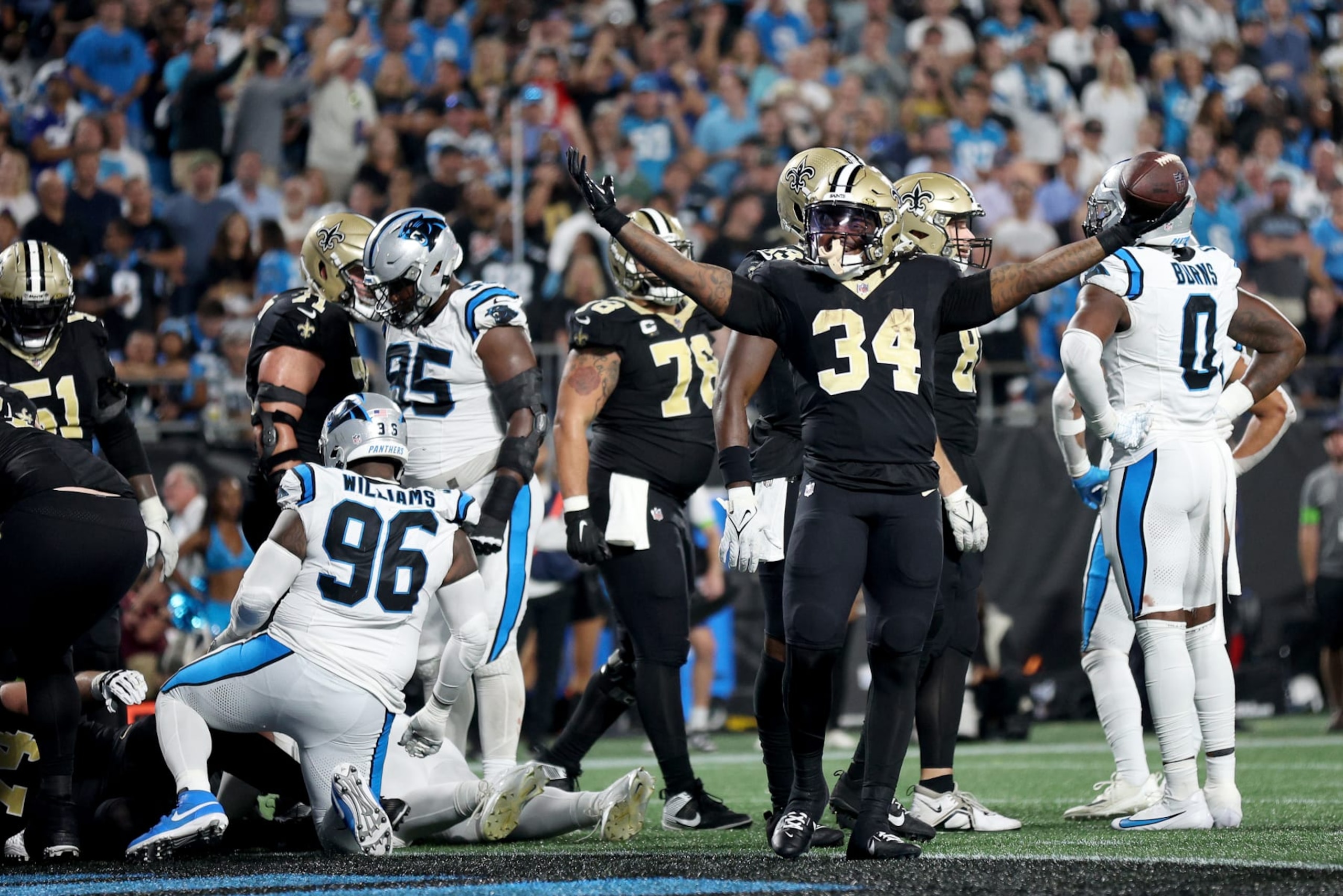 CHARLOTTE, NORTH CAROLINA - SEPTEMBER 18: Tony Jones Jr. #34 of the New Orleans Saints a touchdown against the Carolina Panthers during the third quarter in the game at Bank of America Stadium on September 18, 2023 in Charlotte, North Carolina. (Photo by Jared C. Tilton/Getty Images)