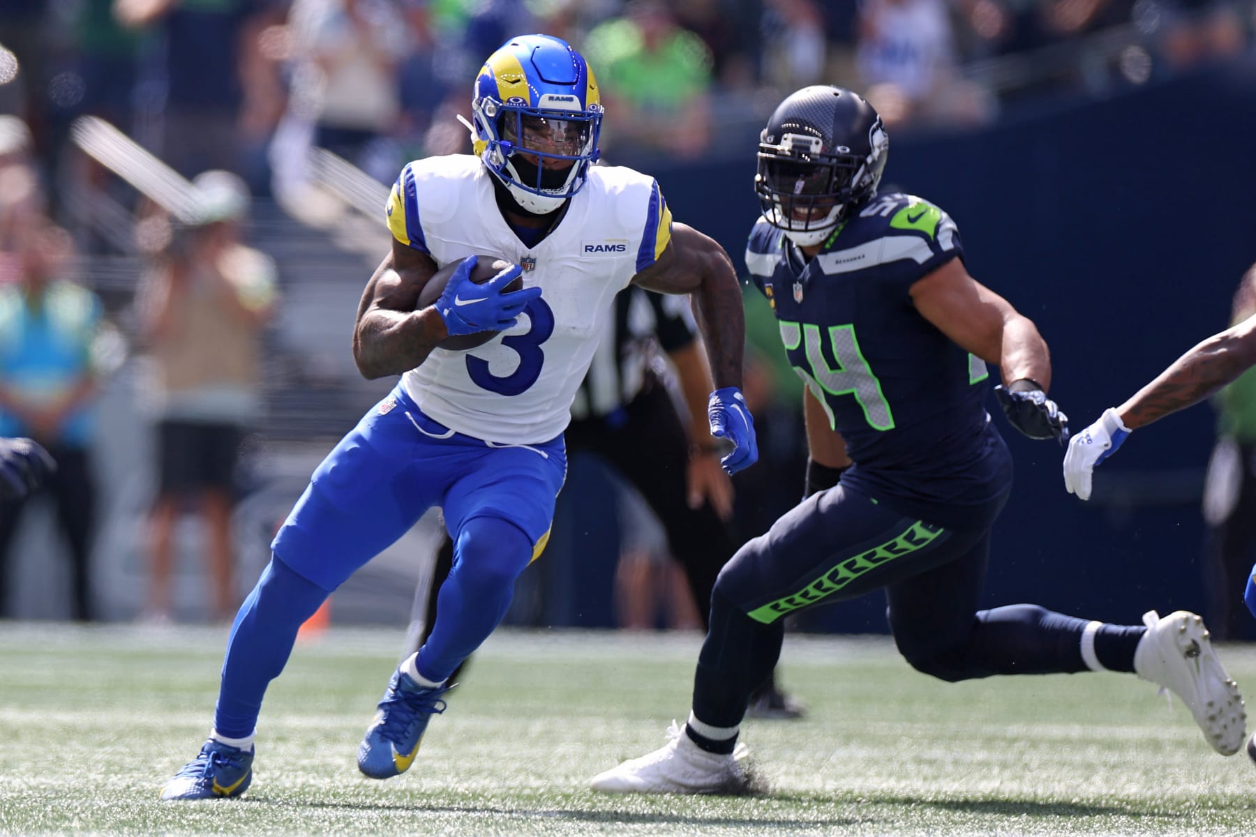 SEATTLE, WASHINGTON - SEPTEMBER 10:  Cam Akers #3 of the Los Angeles Rams runs the ball against Bobby Wagner #54 of the Seattle Seahawks during the first half at Lumen Field on September 10, 2023 in Seattle, Washington. (Photo by Steph Chambers/Getty Images)