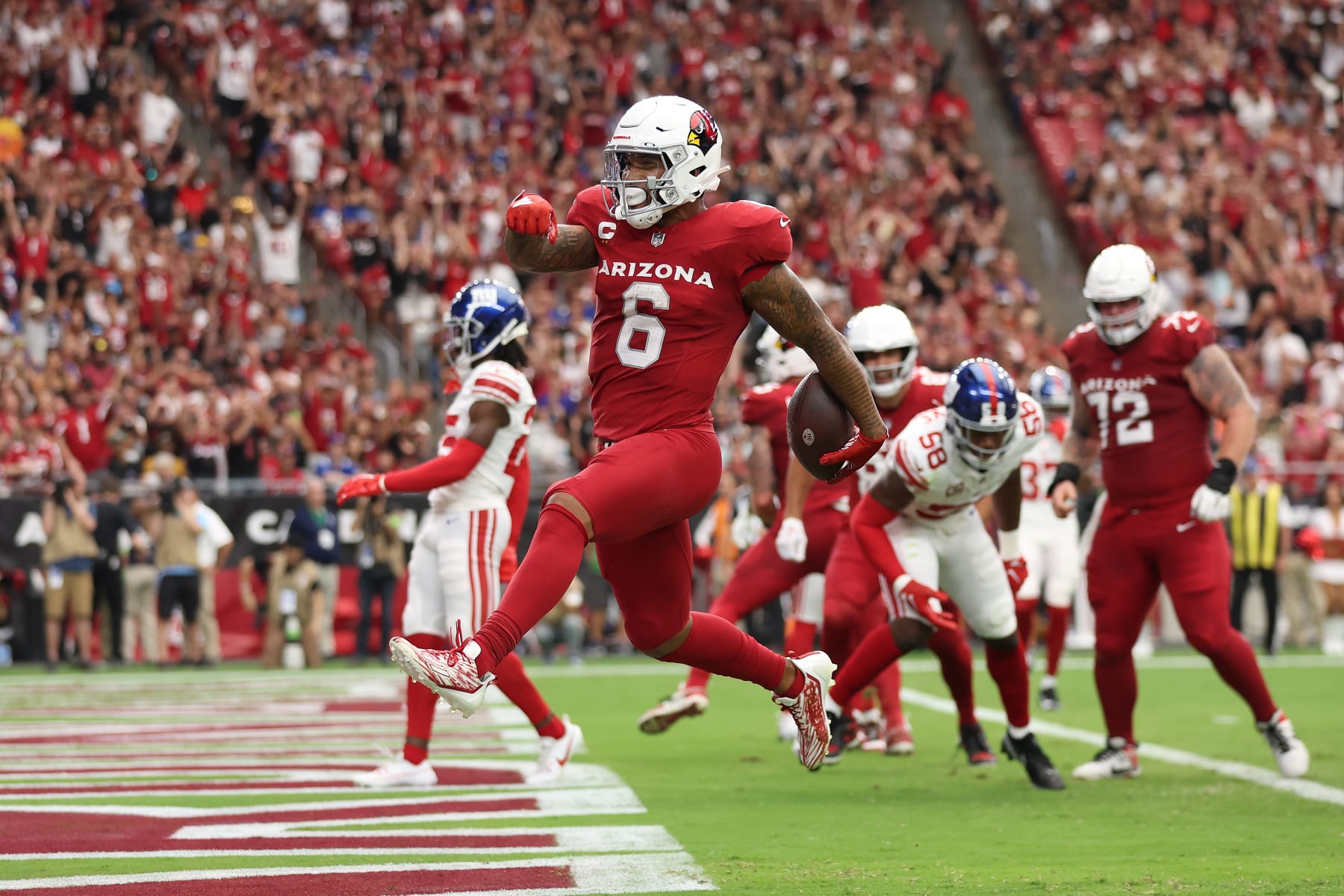 GLENDALE, ARIZONA - SEPTEMBER 17: James Conner #6 of the Arizona Cardinals scores a touchdown during the first quarter in the game against the New York Giants at State Farm Stadium on September 17, 2023 in Glendale, Arizona. (Photo by Christian Petersen/Getty Images)