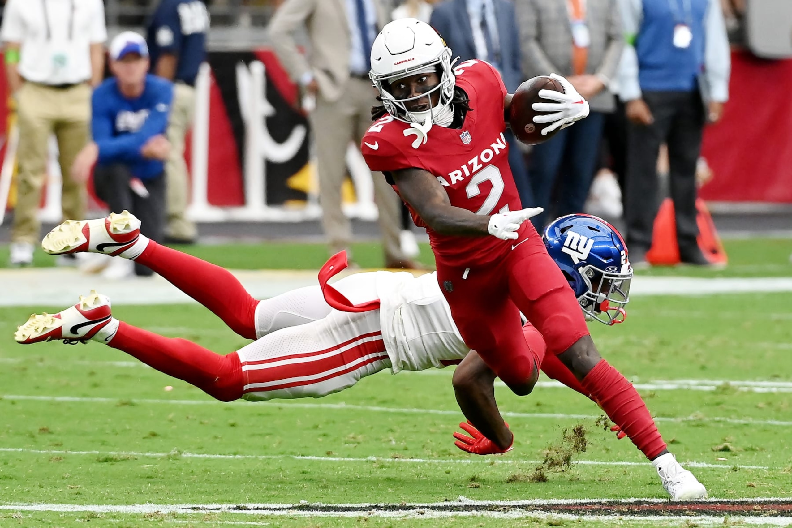 GLENDALE, ARIZONA - SEPTEMBER 17: Marquise Brown #2 of the Arizona Cardinals avoids a tackle from Jason Pinnock #27 of the New York Giants during the second quarter at State Farm Stadium on September 17, 2023 in Glendale, Arizona. (Photo by Norm Hall/Getty Images)
