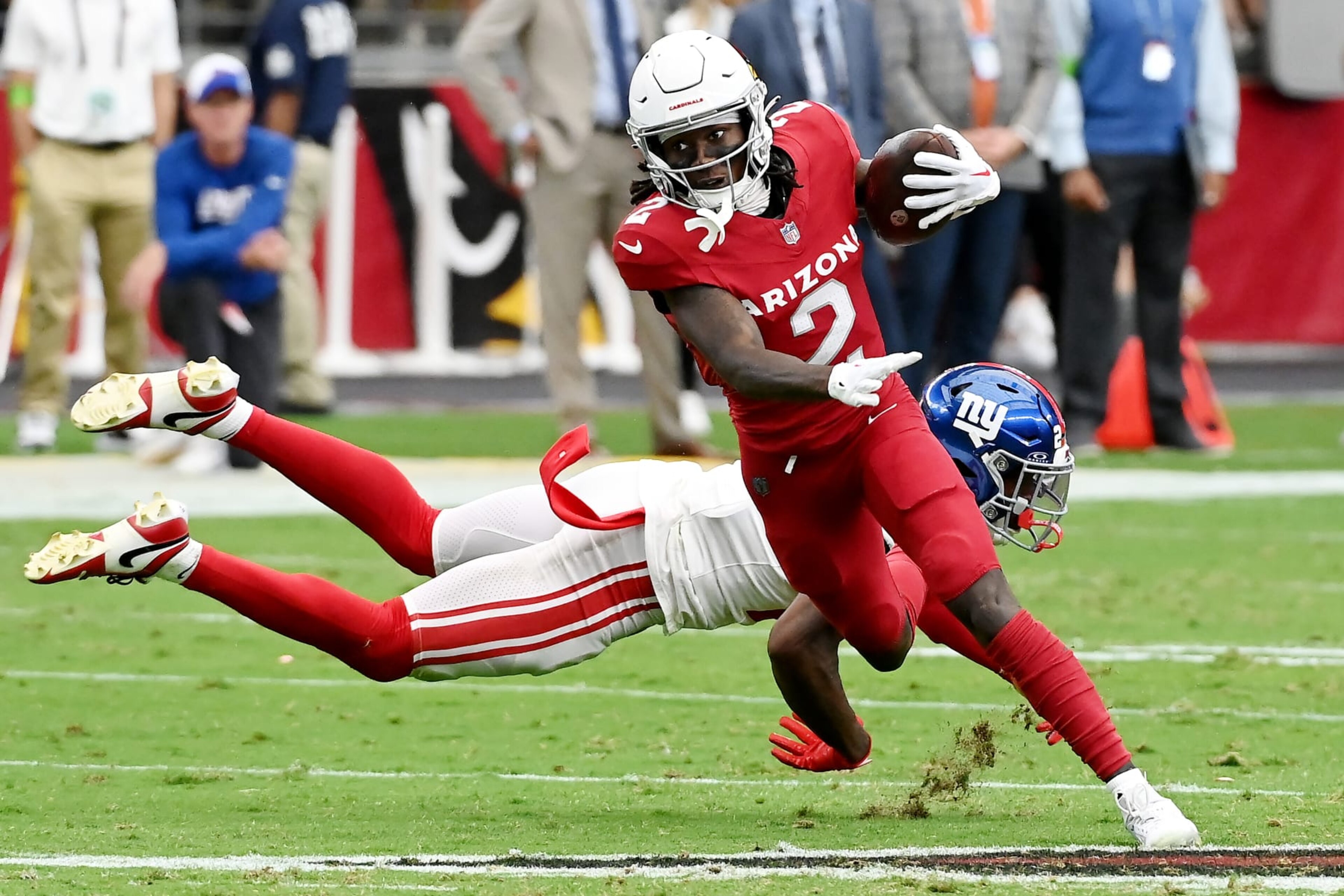 GLENDALE, ARIZONA - SEPTEMBER 17: Marquise Brown #2 of the Arizona Cardinals avoids a tackle from Jason Pinnock #27 of the New York Giants during the second quarter at State Farm Stadium on September 17, 2023 in Glendale, Arizona. (Photo by Norm Hall/Getty Images)
