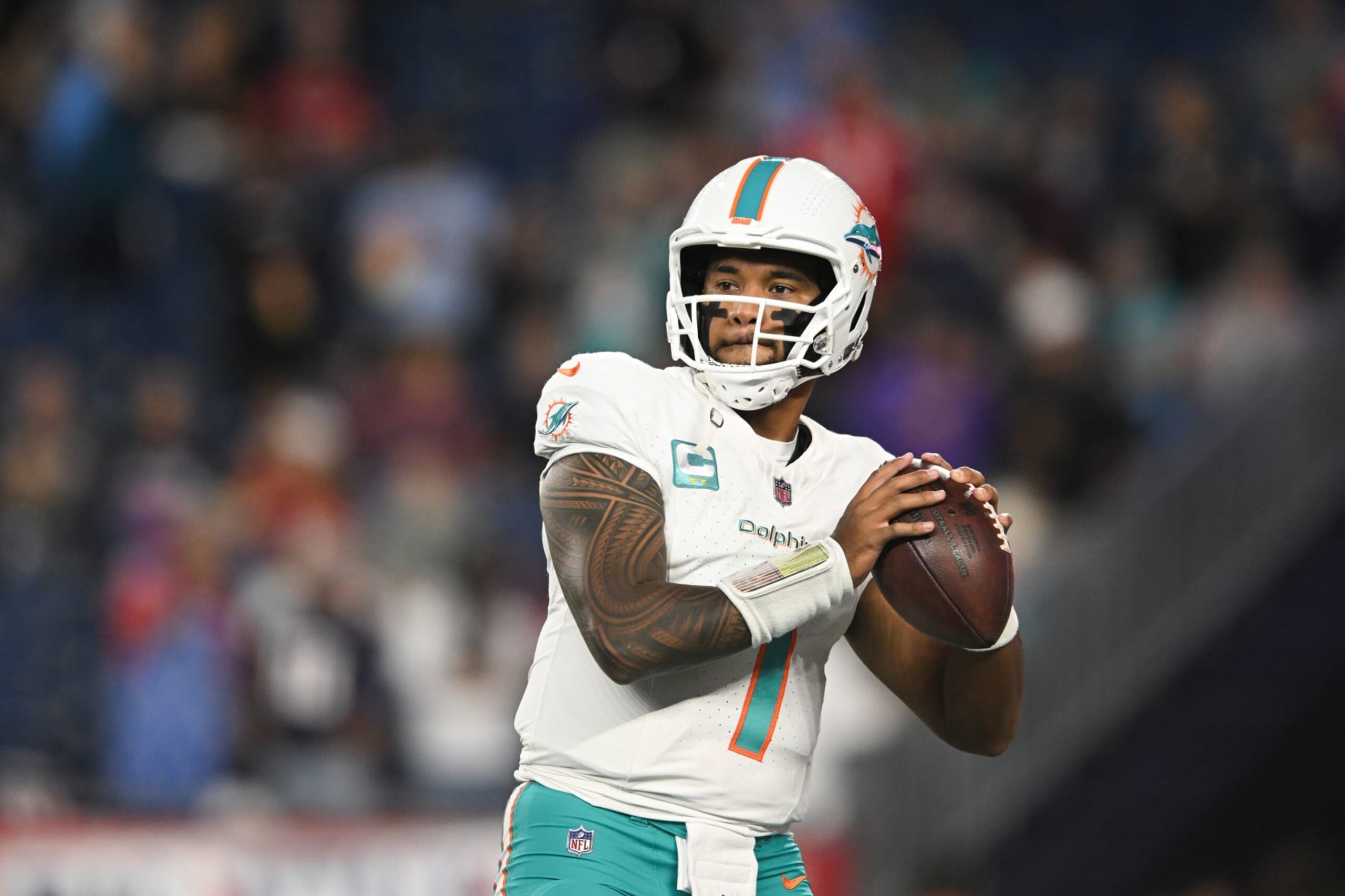 FOXBORO, MA - SEPTEMBER 17: Tua Tagovailoa #1 of the Miami Dolphins looks to throw the football during warmups prior to the start of the game against the New England Patriots at Gillette Stadium on September 17, 2023 in Foxboro, Massachusetts. (Photo by Kathryn Riley/Getty Images) FOXBORO, MA - SEPTEMBER 17: Tua Tagovailoa #1 of the Miami Dolphins looks to throw the football during warmups prior to the start of the game against the New England Patriots at Gillette Stadium on September 17, 2023 in Foxboro, Massachusetts. (Photo by Kathryn Riley/Getty Images)