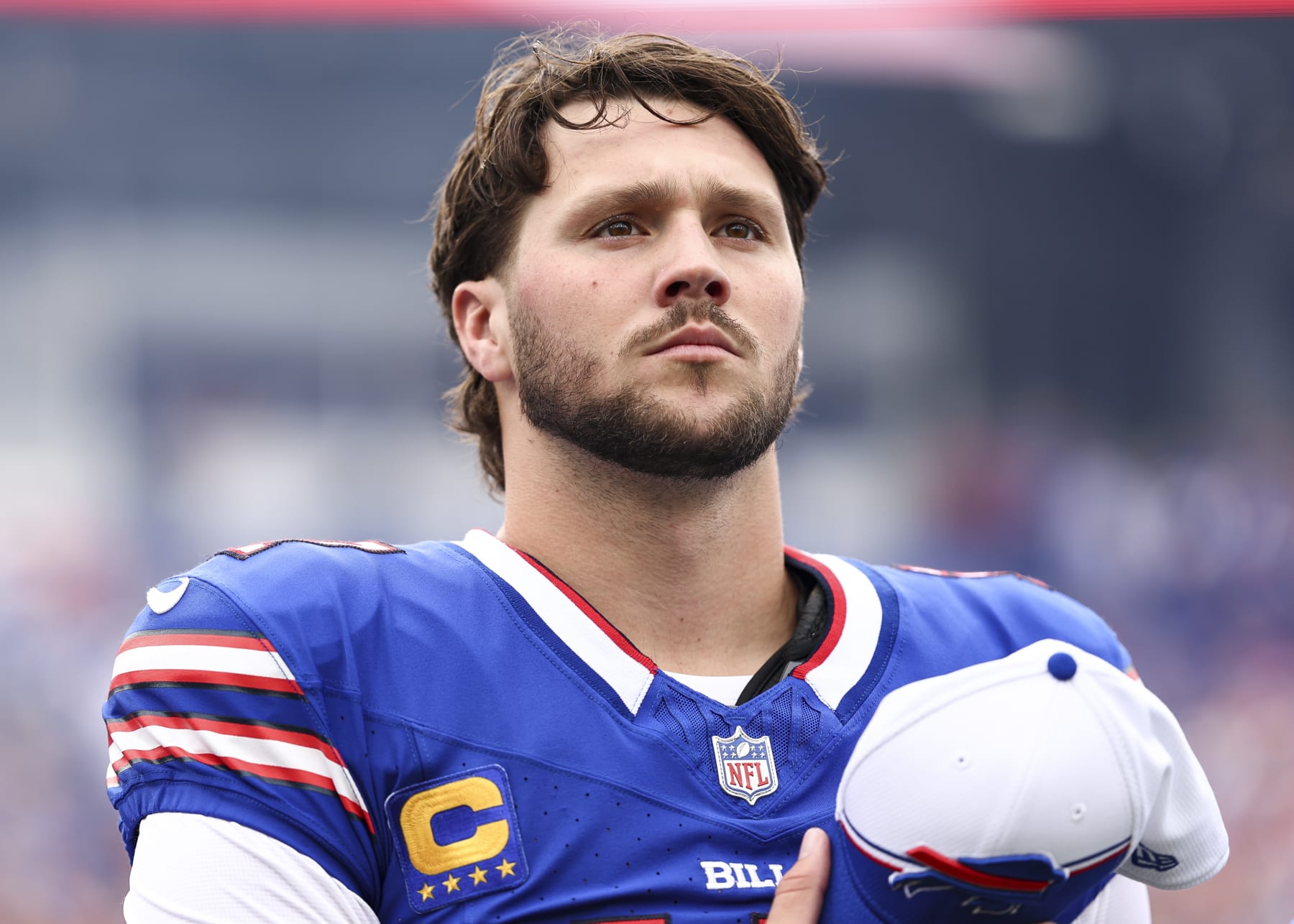 ORCHARD PARK, NY - SEPTEMBER 17: Josh Allen #17 of the Buffalo Bills stands on the sidelines during the national anthem prior to an NFL football game against the Las Vegas Raiders at Highmark Stadium on September 17, 2023 in Orchard Park, New York. (Photo by Kevin Sabitus/Getty Images)