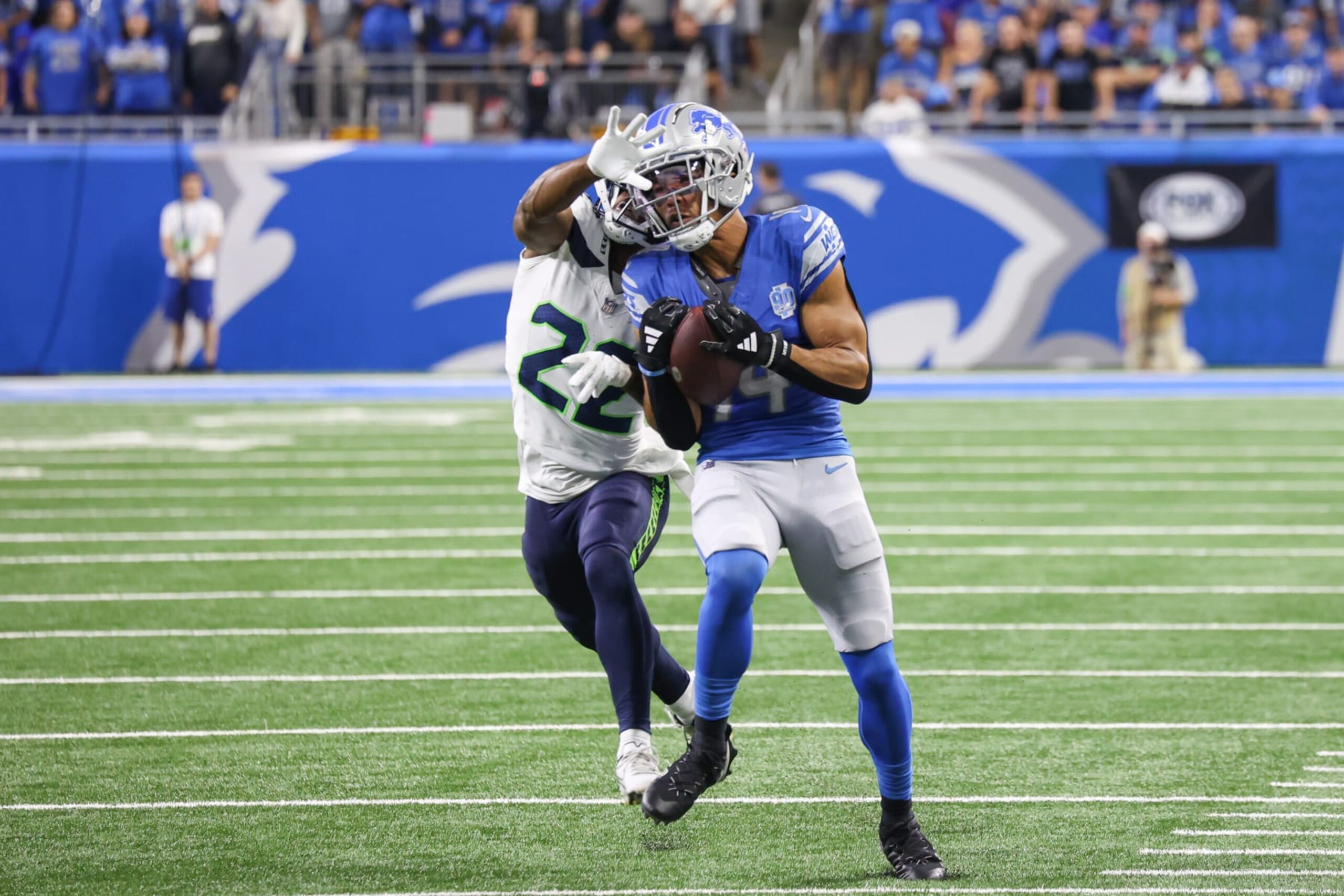 DETROIT, MI - SEPTEMBER 17:  Detroit Lions wide receiver Amon-Ra St. Brown (14) catches a pass against Seattle Seahawks cornerback Tre Brown (22) during the second quarter of an NFL football game between the Seattle Seahawks and the Detroit Lions on September 17, 2023 at Ford Field in Detroit, Michigan.  (Photo by Scott W. Grau/Icon Sportswire via Getty Images)