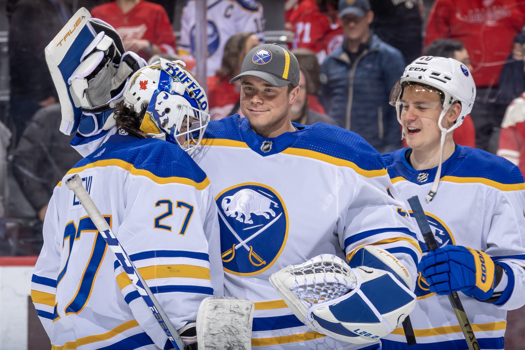 Goaltenders Devon Levi (left) and Eric Comrie (center)
