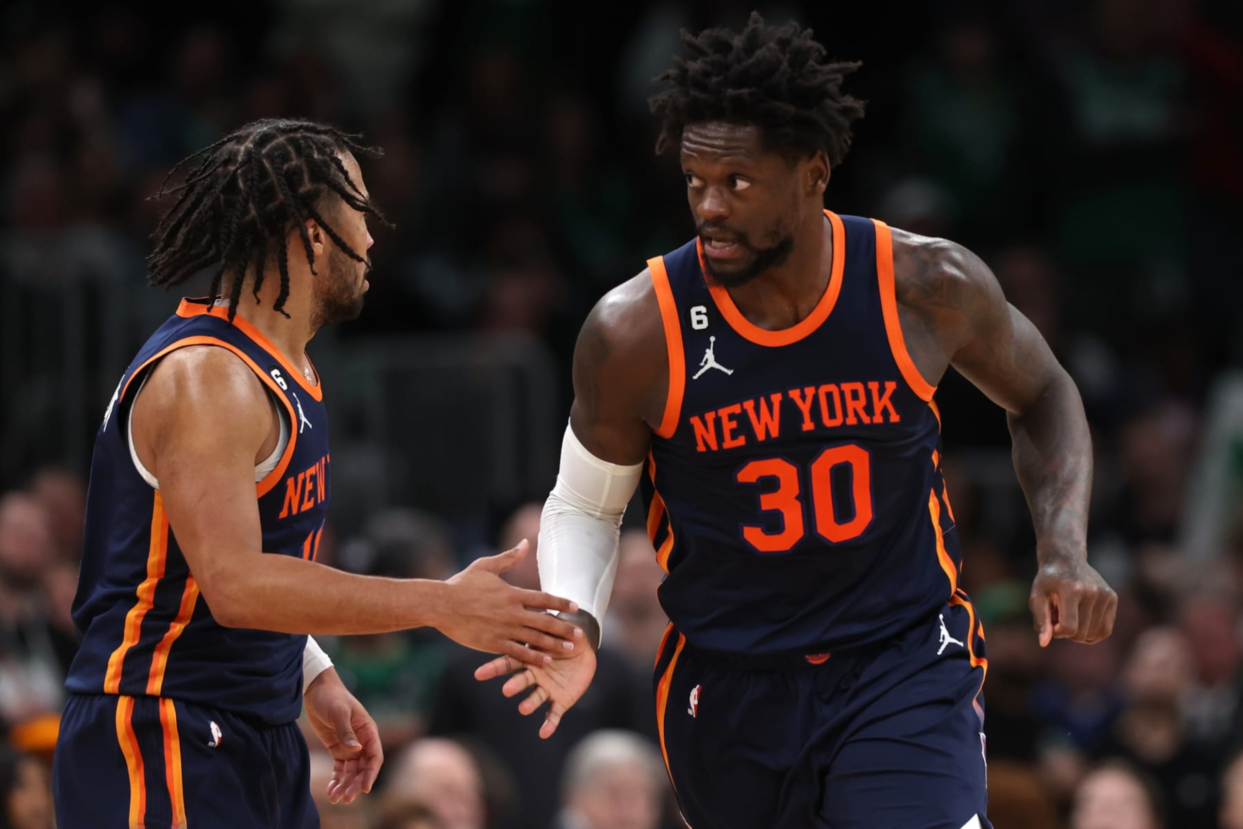 BOSTON, MASSACHUSETTS - JANUARY 26: Julius Randle #30 of the New York Knicks and Jalen Brunson #11 celebrate during the second half against the Boston Celtics at TD Garden on January 26, 2023 in Boston, Massachusetts. The Knicks defeat the Celtics 120-117 in overtime. NOTE TO USER: User expressly acknowledges and agrees that, by downloading and or using this photograph, User is consenting to the terms and conditions of the Getty Images License Agreement.  (Photo by Maddie Meyer/Getty Images)