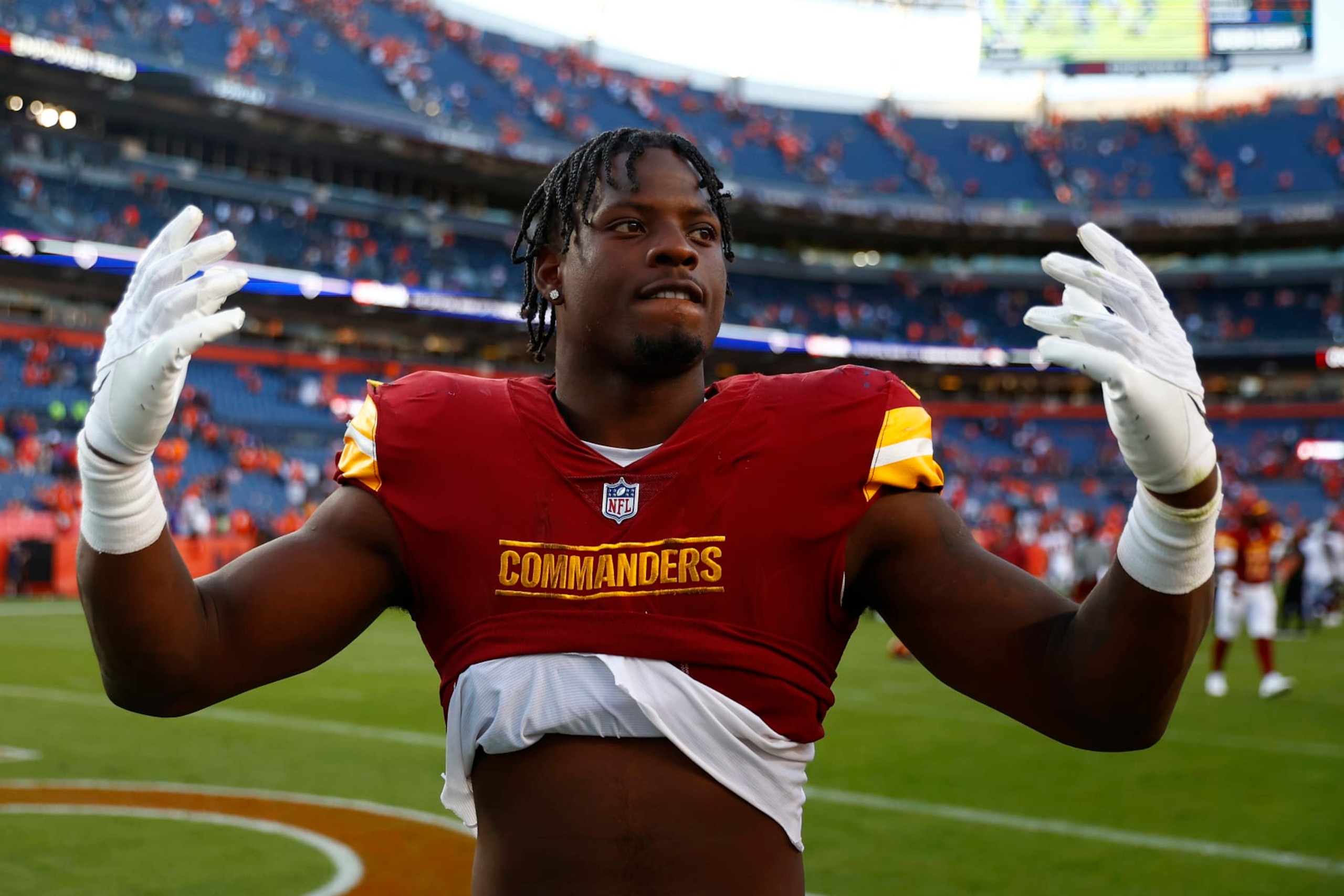DENVER, COLORADO - SEPTEMBER 17: Brian Robinson Jr. #8 of the Washington Commanders celebrates after his team's 35-33 win against the Denver Broncos at Empower Field At Mile High on September 17, 2023 in Denver, Colorado. (Photo by Justin Edmonds/Getty Images) DENVER, COLORADO - SEPTEMBER 17: Brian Robinson Jr. #8 of the Washington Commanders celebrates after his team's 35-33 win against the Denver Broncos at Empower Field At Mile High on September 17, 2023 in Denver, Colorado. (Photo by Justin Edmonds/Getty Images)