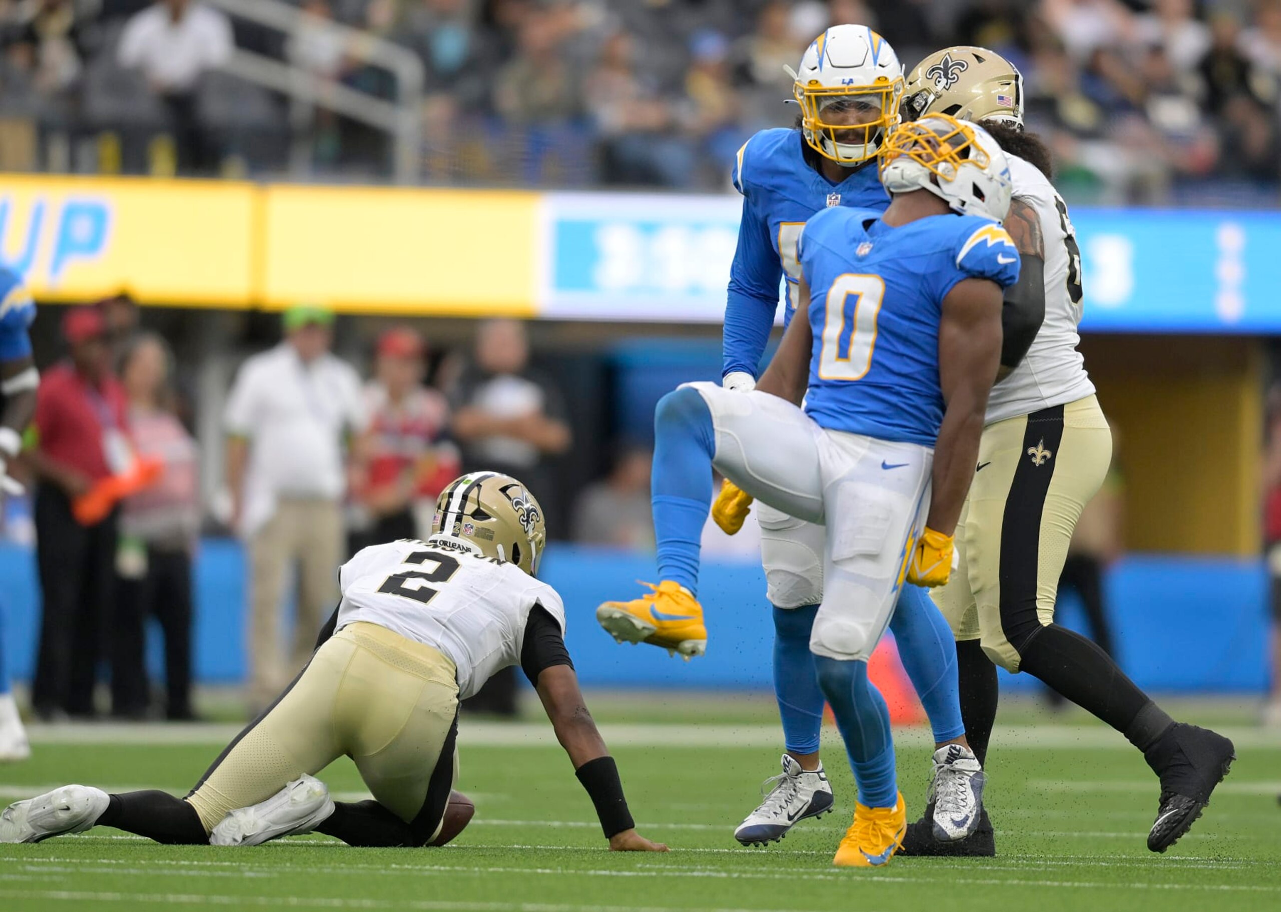 INGLEWOOD, CALIFORNIA - AUGUST 20: Daiyan Henley #0 of the Los Angeles Chargers celebrates after sacking Quarterback Jameis Winston #2 of the New Orleans Saints in the first half of a preseason game at SoFi Stadium on August 20, 2023 in Inglewood, California. (Photo by John McCoy/Getty Images)