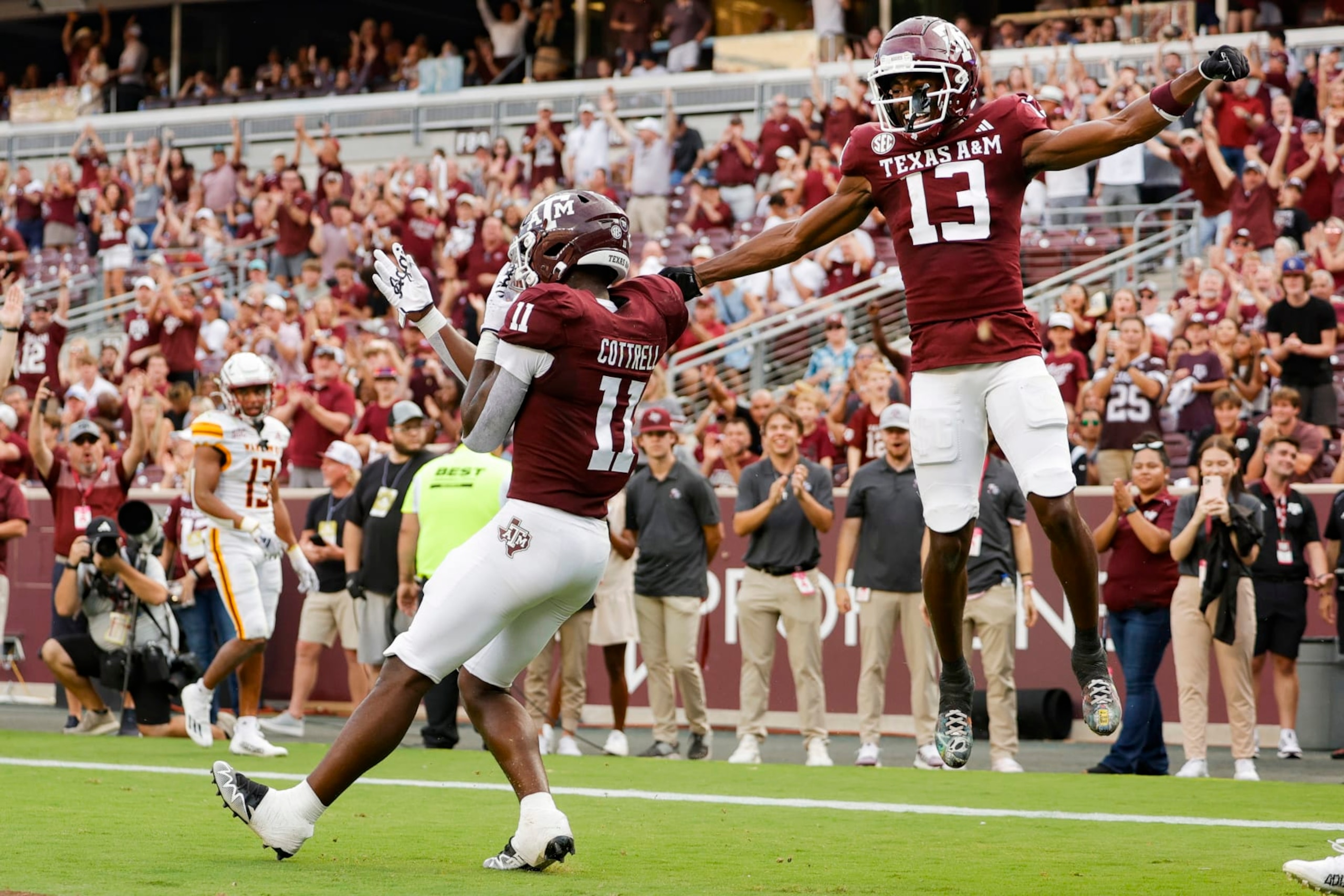 COLLEGE STATION, TEXAS - SEPTEMBER 16: Raymond Cottrell #11 of the Texas A&M Aggies and Micah Tease #13 celebrate a touchdown against the Louisiana Monroe Warhawks during the second half at Kyle Field on September 16, 2023 in College Station, Texas. (Photo by Carmen Mandato/Getty Images) COLLEGE STATION, TEXAS - SEPTEMBER 16: Raymond Cottrell #11 of the Texas A&M Aggies and Micah Tease #13 celebrate a touchdown against the Louisiana Monroe Warhawks during the second half at Kyle Field on September 16, 2023 in College Station, Texas. (Photo by Carmen Mandato/Getty Images)