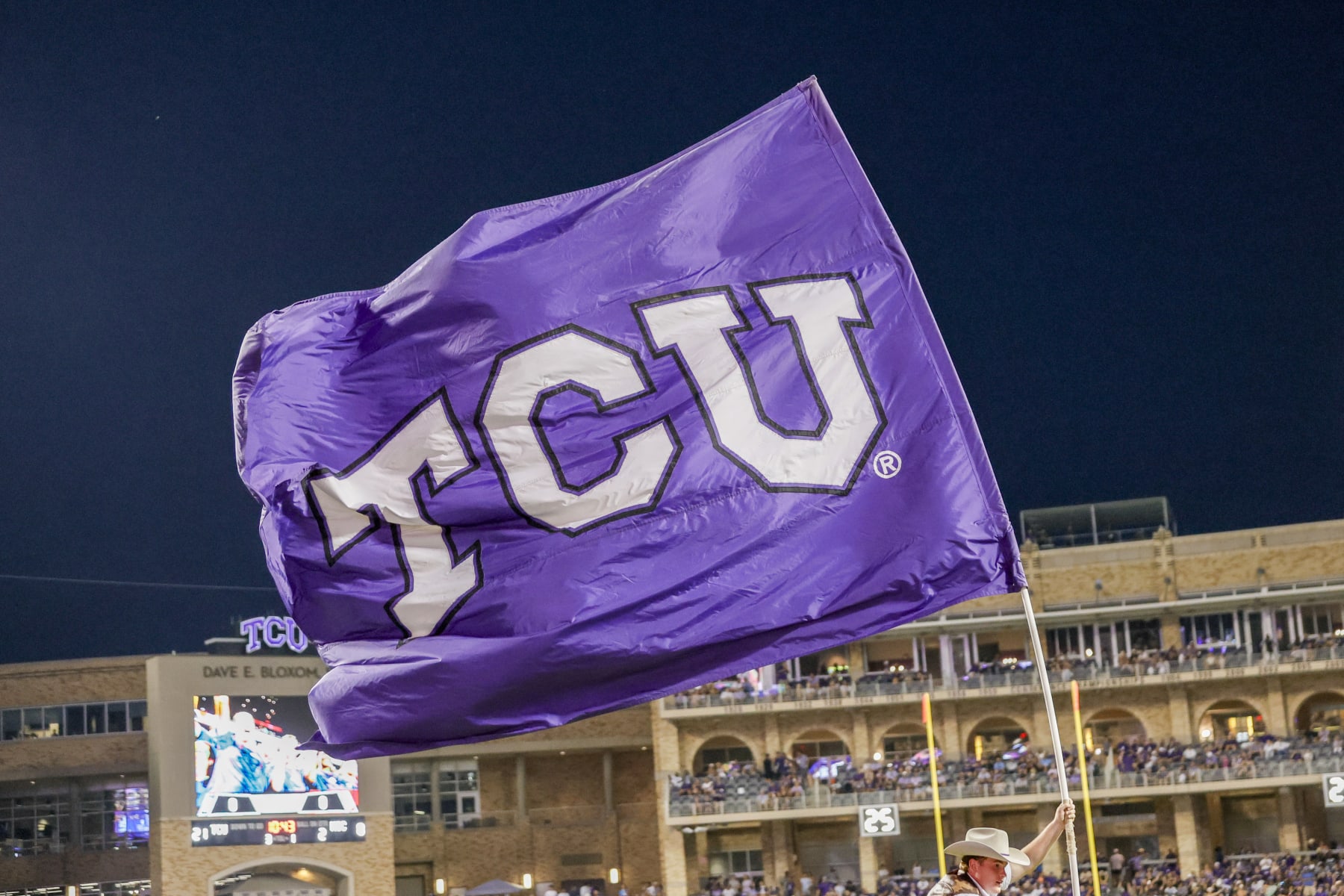 FORT WORTH, TX - SEPTEMBER 09: A TCU Horned Frogs flag flies after a touchdown during the game between the TCU Horned Frogs and the Nicholls State Colonels on September 9, 2013 at Amon G. Carter Stadium in Fort Worth, Tx. (Photo by Matthew Pearce/Icon Sportswire via Getty Images)