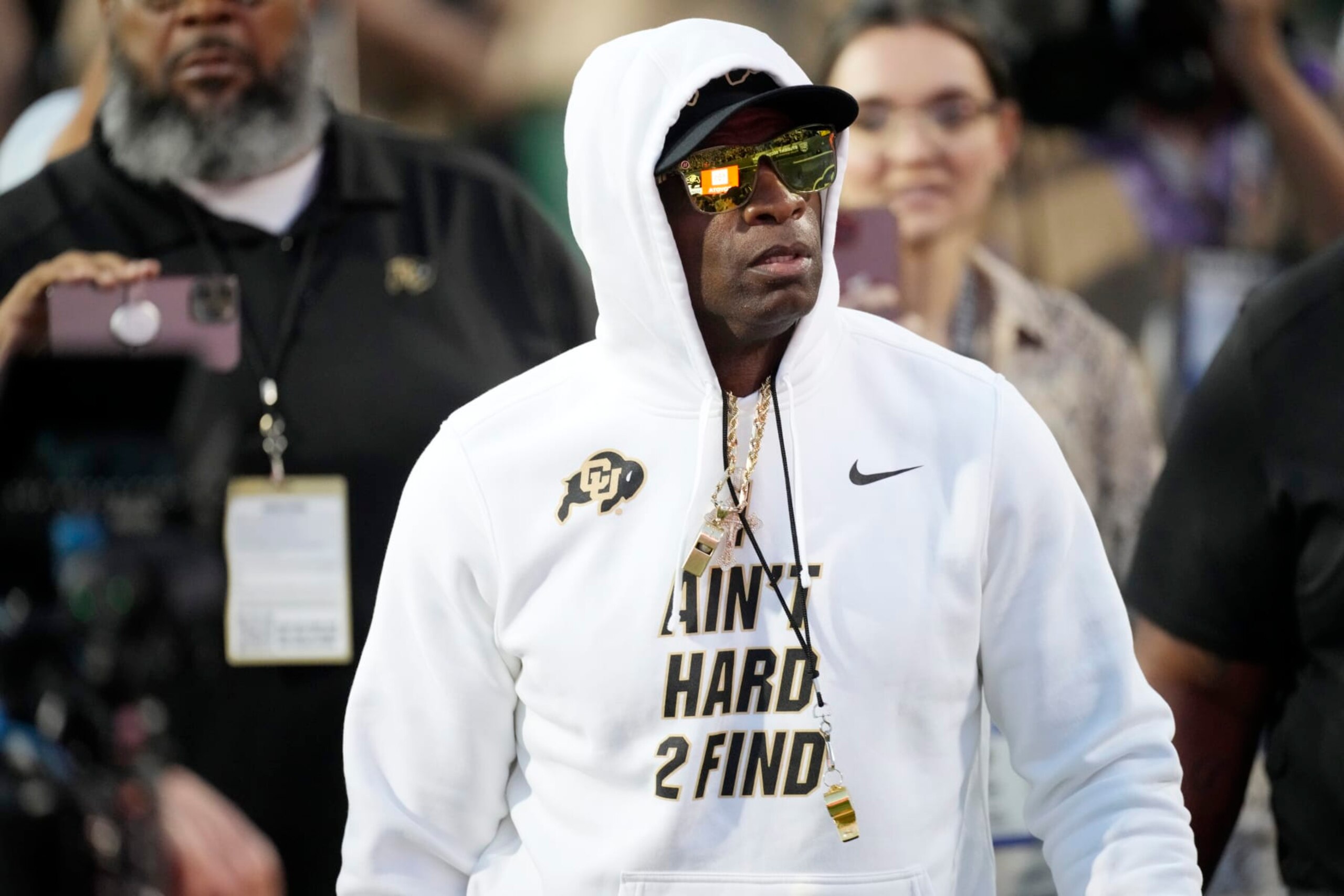 Colorado head coach Deion Sanders walks the perimeter of the field as players warm up before an NCAA college football game against Colorado State, Saturday, Sept. 16, 2023, in Boulder, Colo. (AP Photo/David Zalubowski)
