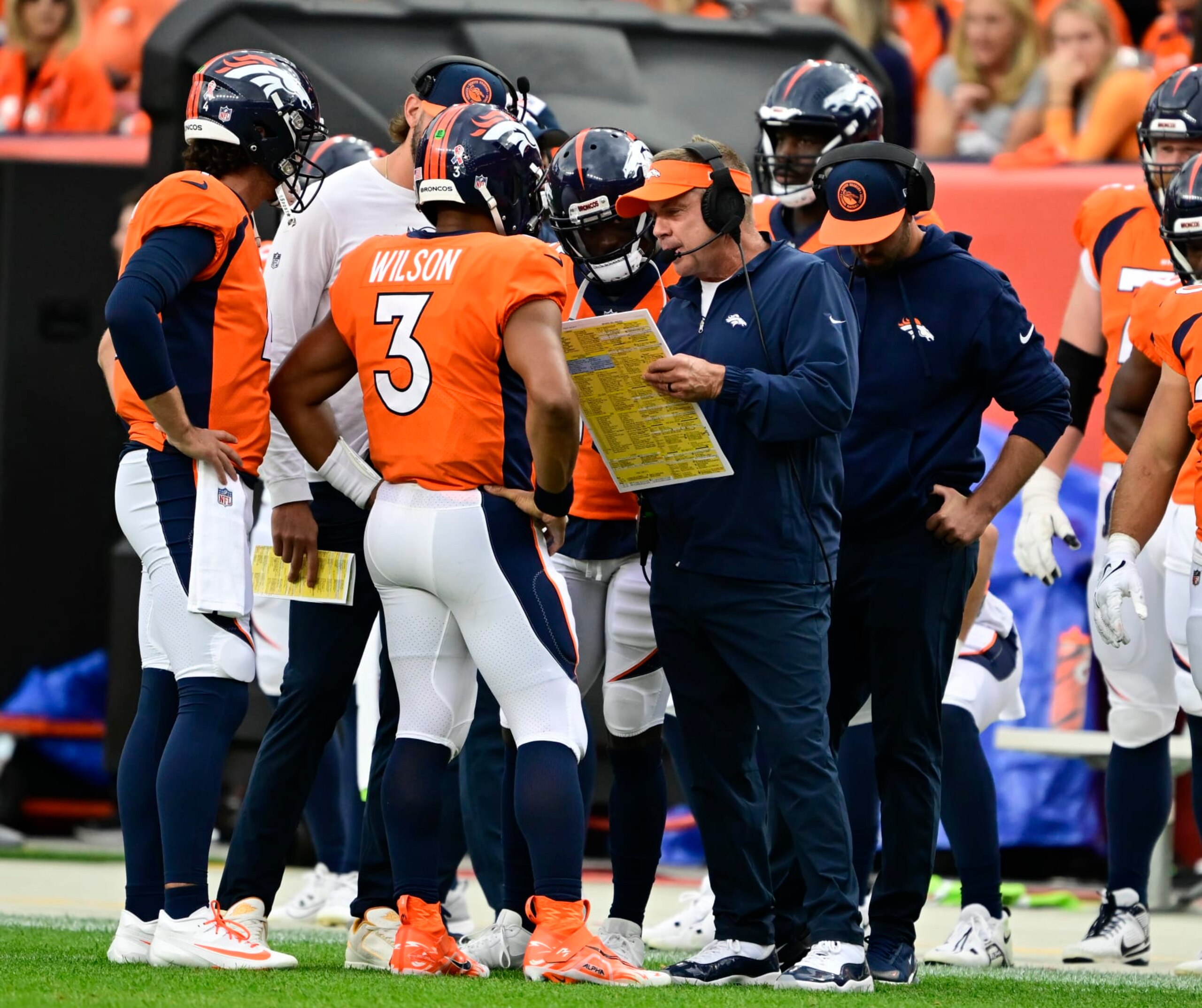 DENVER, CO - SEPTEMBER 10: Denver Broncos head coach Sean Payton talks to quarterback Russell Wilson (3) on a timeout during the game against the Las Vegas Raiders at Empower Field at Mile High September 10, 2023. (Photo by Andy Cross/MediaNews Group/The Denver Post via Getty Images)