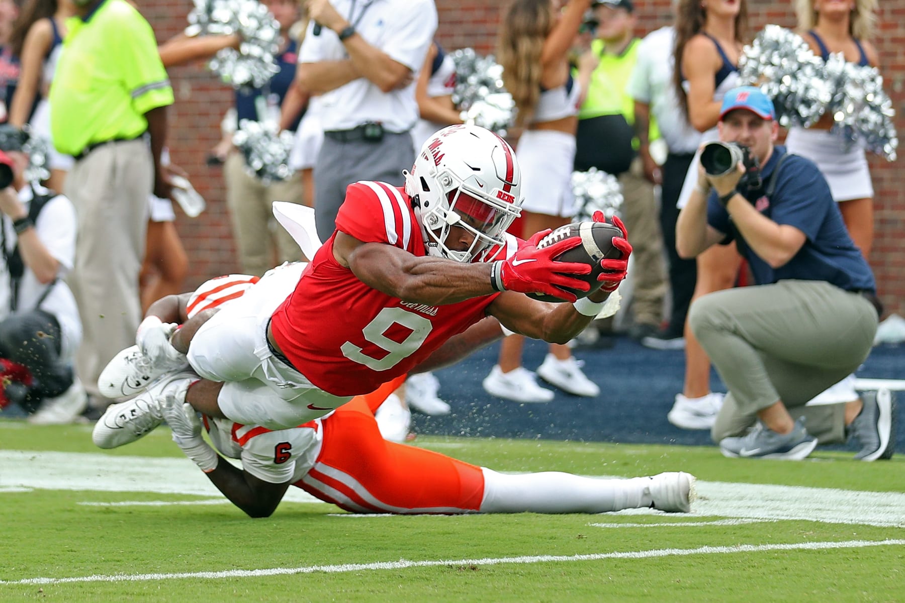 OXFORD, MISSISSIPPI - SEPTEMBER 02: Tre Harris #9 of the Mississippi Rebels dives into the end zone for a touchdown against Cam Sims #6 of the Mercer Bears during the first half at Vaught-Hemingway Stadium on September 02, 2023 in Oxford, Mississippi. (Photo by Justin Ford/Getty Images)