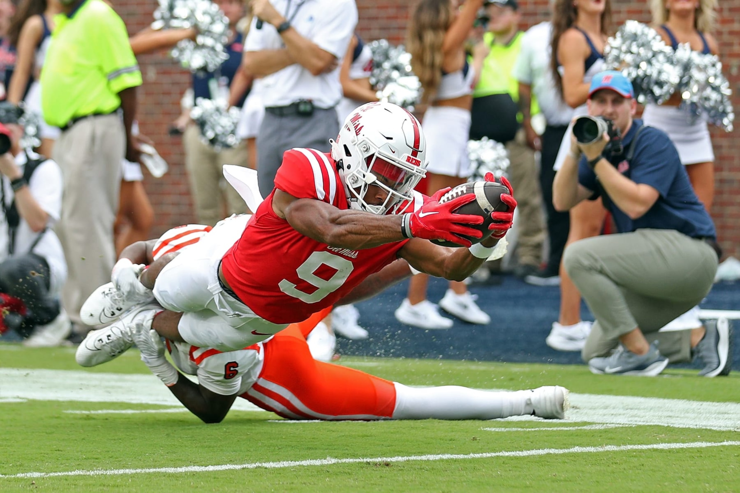 OXFORD, MISSISSIPPI - SEPTEMBER 02: Tre Harris #9 of the Mississippi Rebels dives into the end zone for a touchdown against Cam Sims #6 of the Mercer Bears during the first half at Vaught-Hemingway Stadium on September 02, 2023 in Oxford, Mississippi. (Photo by Justin Ford/Getty Images)