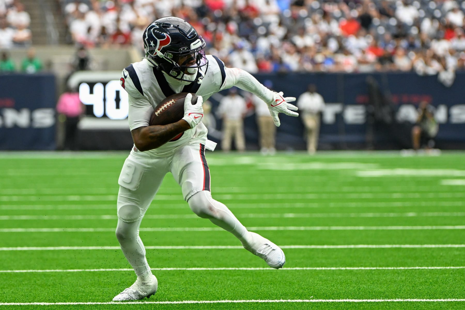 HOUSTON, TX - SEPTEMBER 17: Houston Texans wide receiver Tank Dell (3) looks for running room in the flat after a short reception during the football game between the Indianapolis Colts and Houston Texans at NRG Stadium on September 17, 2023, in Houston, Texas. (Photo by Ken Murray/Icon Sportswire via Getty Images)