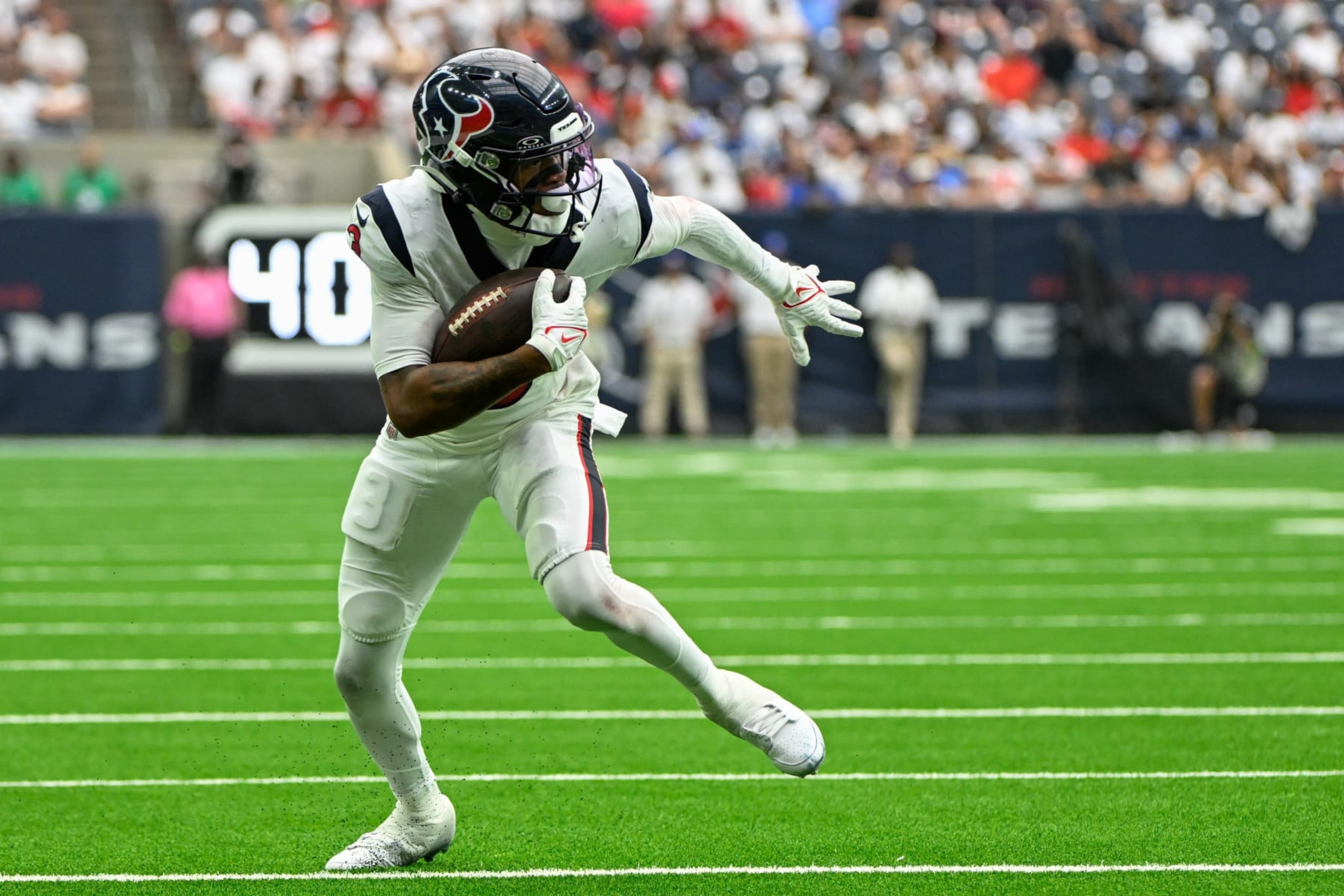 HOUSTON, TX - SEPTEMBER 17: Houston Texans wide receiver Tank Dell (3) looks for running room in the flat after a short reception during the football game between the Indianapolis Colts and Houston Texans at NRG Stadium on September 17, 2023, in Houston, Texas. (Photo by Ken Murray/Icon Sportswire via Getty Images)
